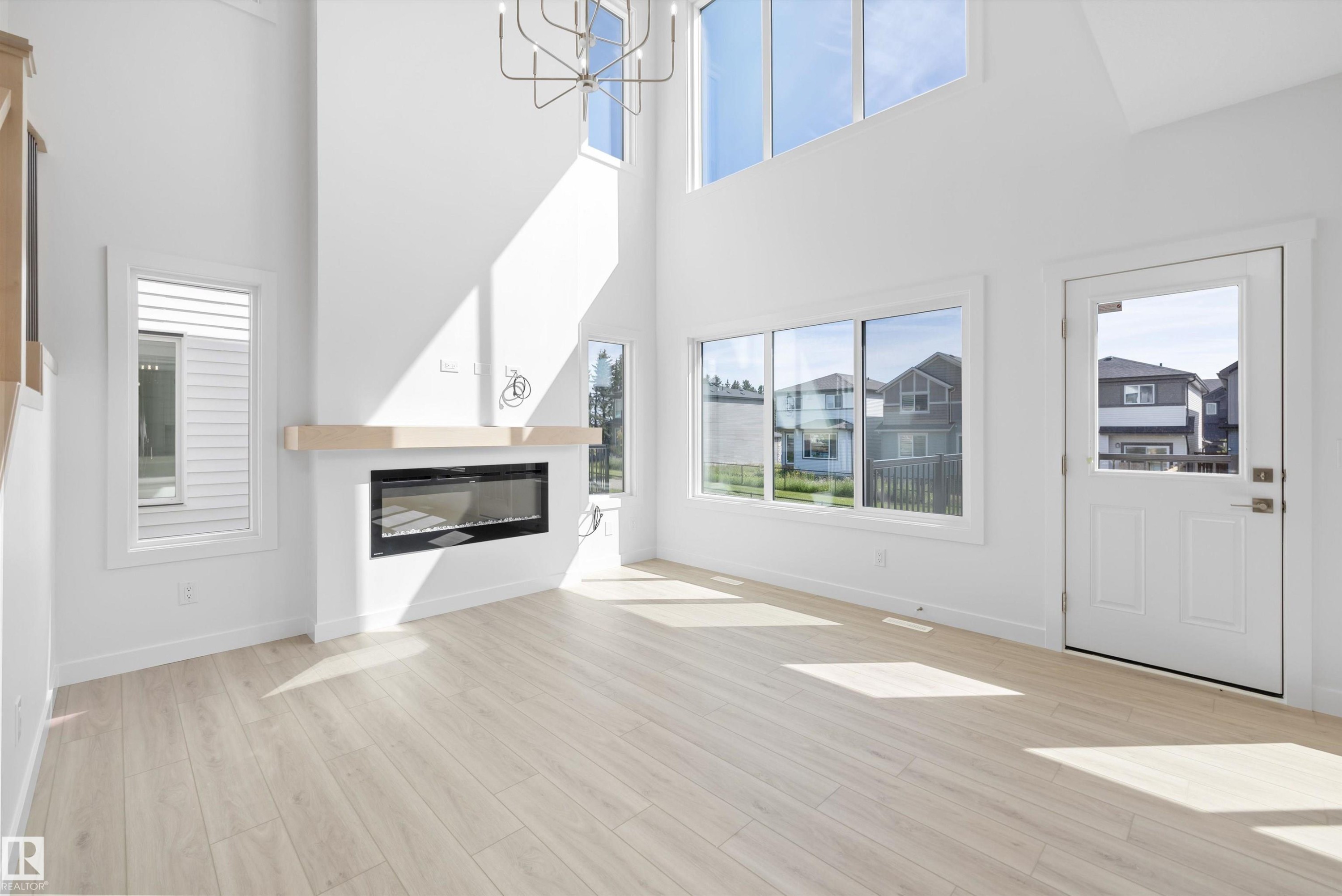 5011 Cawsey Link Sw, Edmonton, AB - Indoor Photo Showing Living Room With Fireplace
