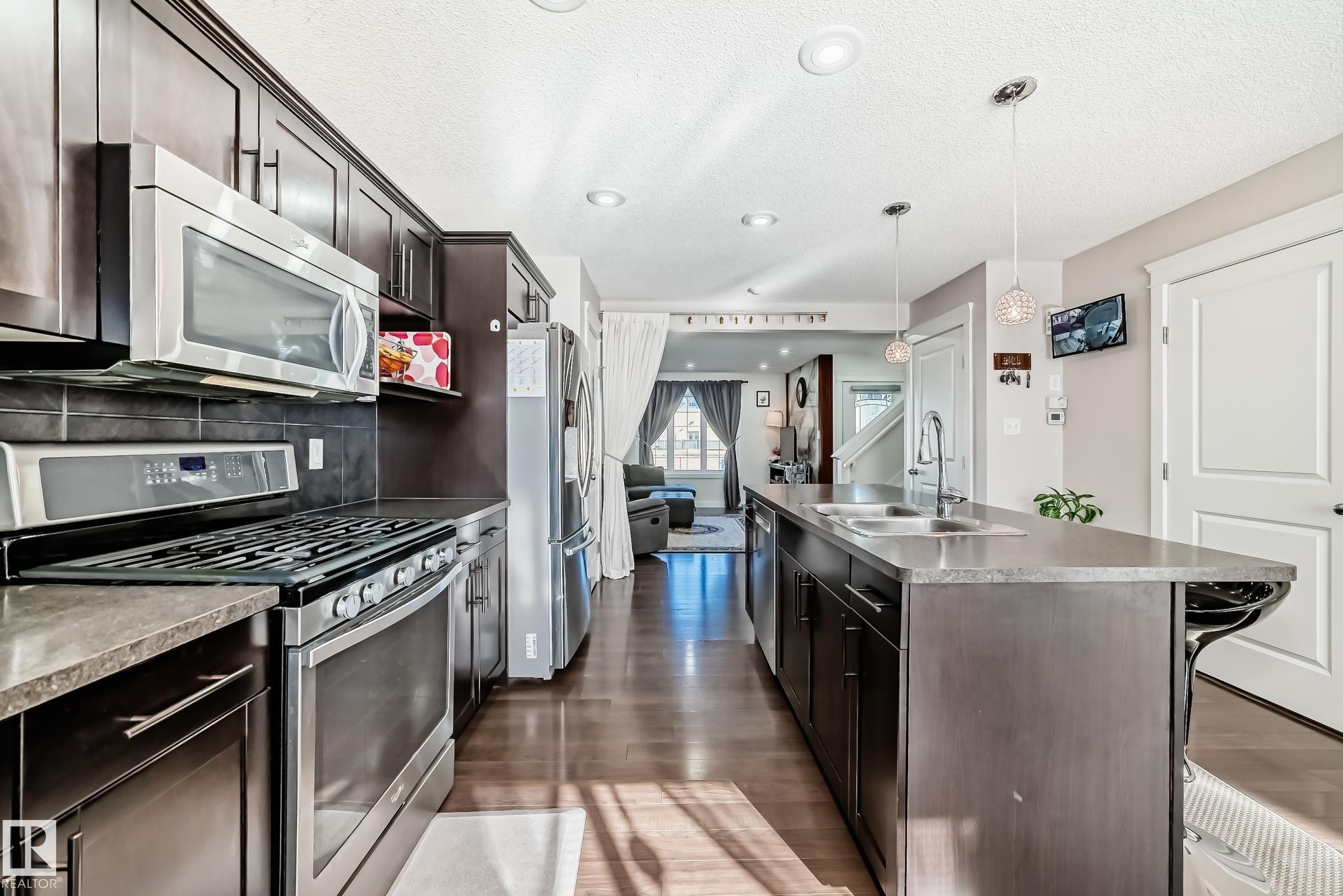 5920 Rue Eaglemont, Beaumont, AB - Indoor Photo Showing Kitchen With Stainless Steel Kitchen With Double Sink With Upgraded Kitchen