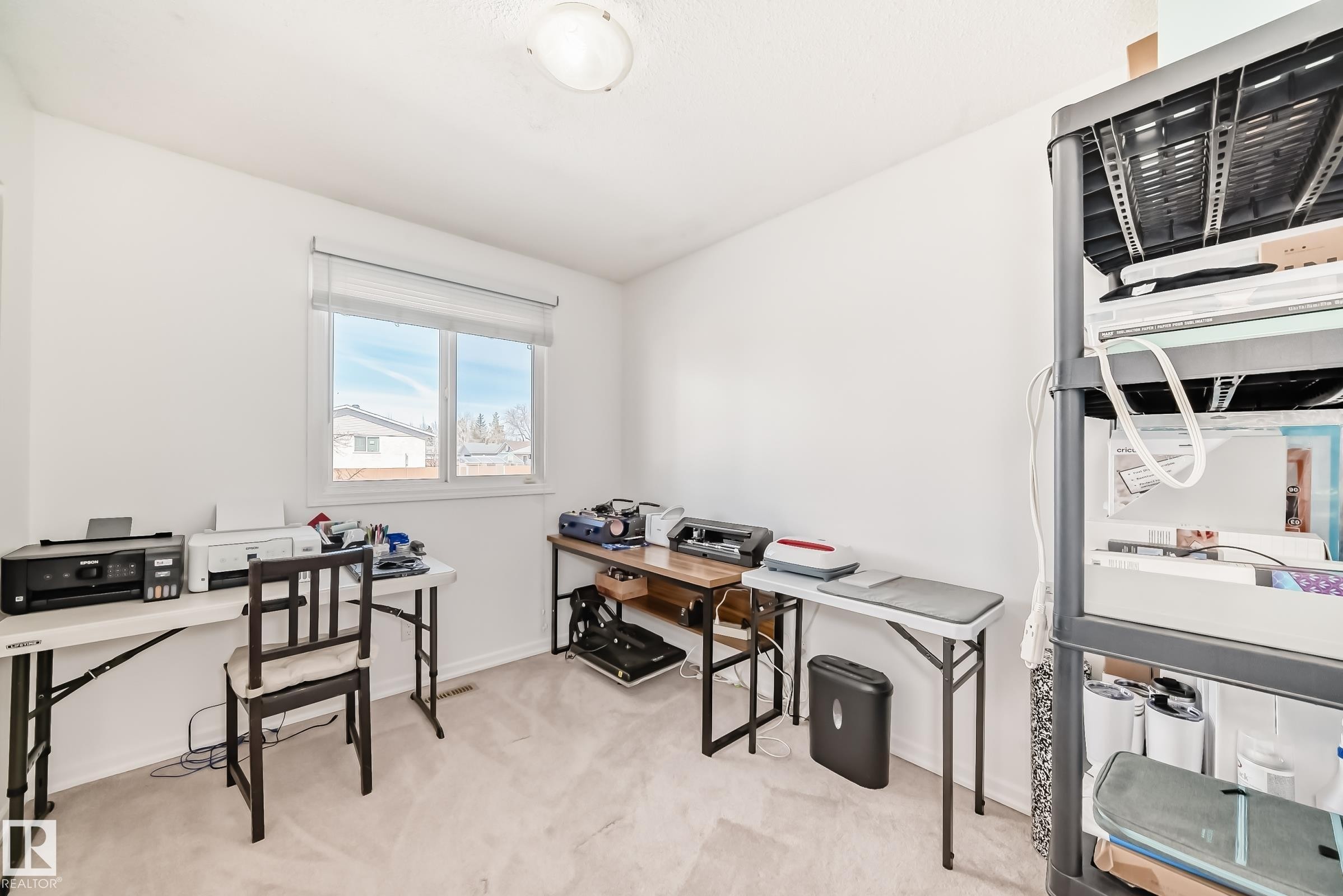 This room features light-colored carpeting, white walls, and a window providing natural light - 11323 162 Avenue, Edmonton, AB - Indoor Photo Showing Office