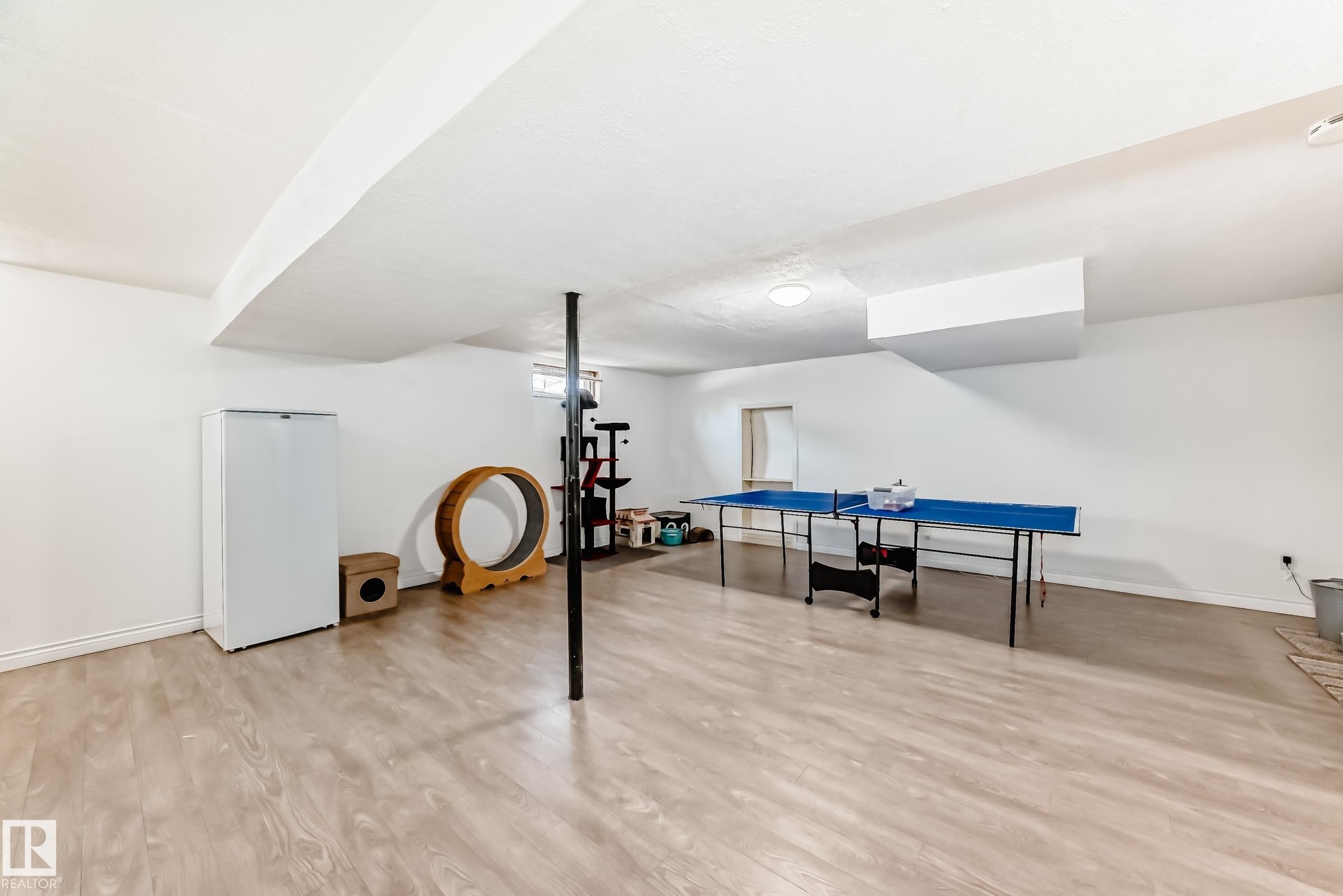 Spacious finished basement featuring light-toned flooring, white walls, and a recessed ceiling light - 11323 162 Avenue, Edmonton, AB - Indoor Photo Showing Other Room
