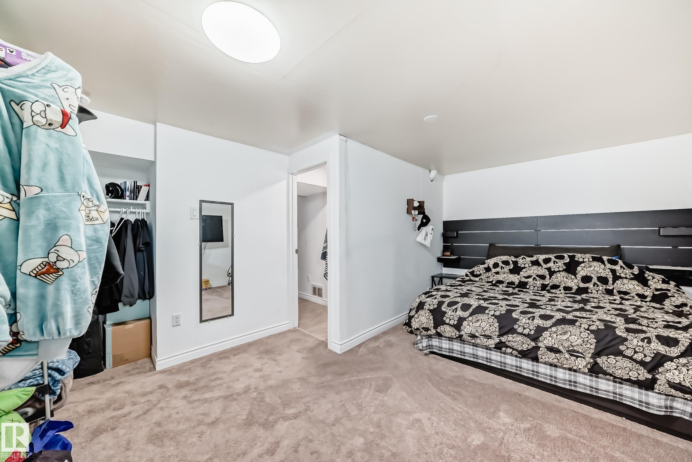 The room features neutral carpet flooring and white walls, with a built-in closet visible - 11323 162 Avenue, Edmonton, AB - Indoor