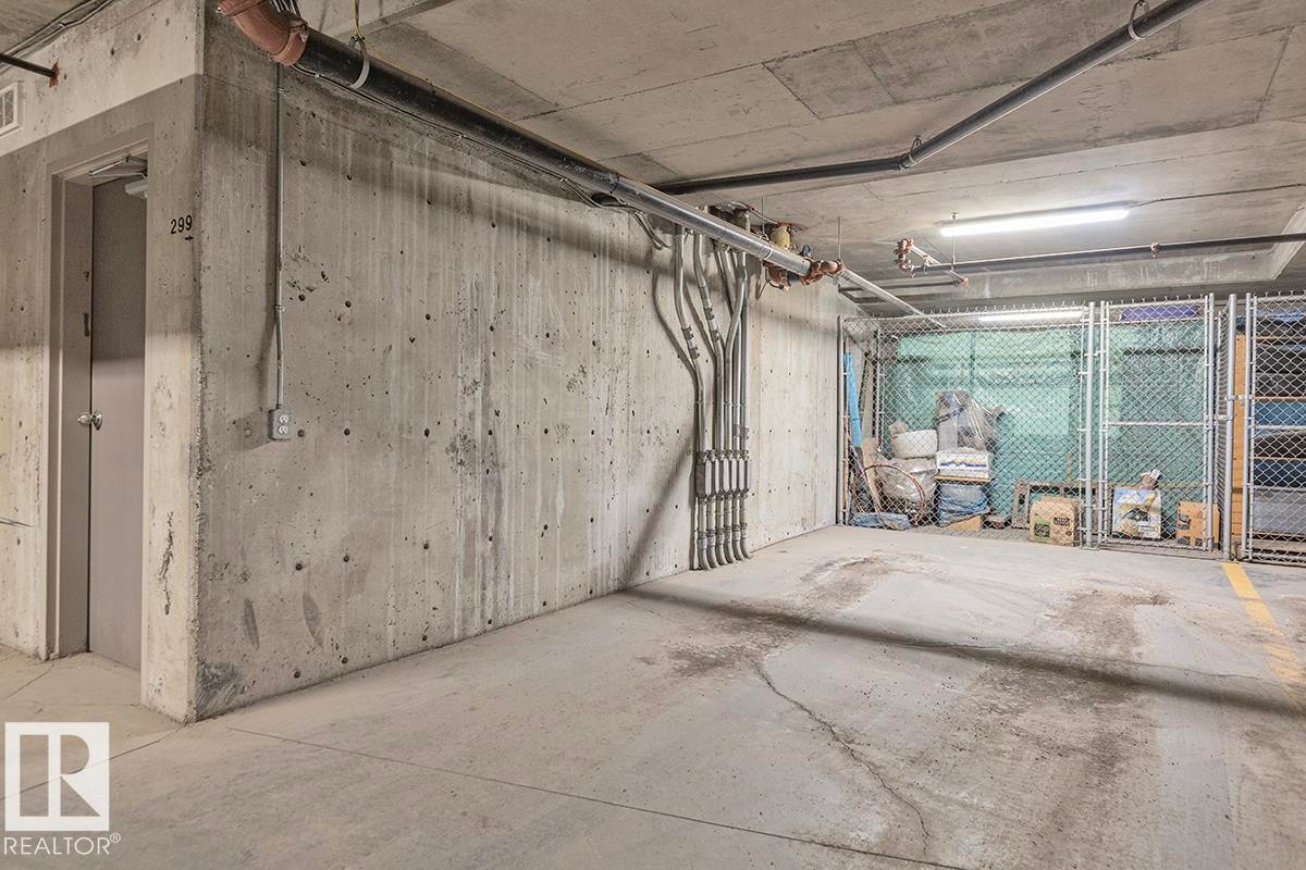 Underground parking space with concrete walls and ceiling - 225 16035 132 Street, Edmonton, AB - Indoor Photo Showing Garage