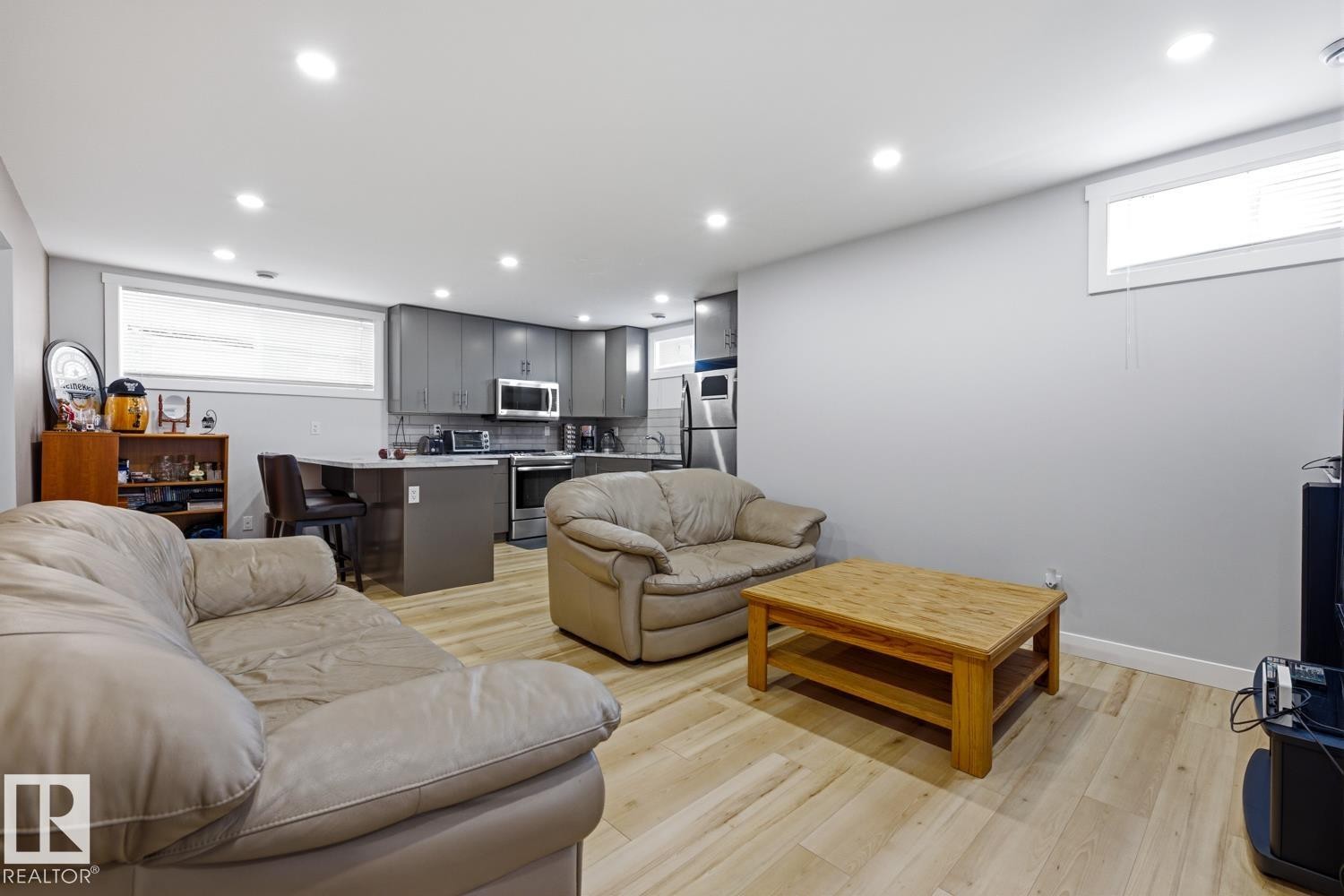 Open concept living space featuring light wood-style flooring and recessed lighting - 10612 79 Street, Edmonton, AB