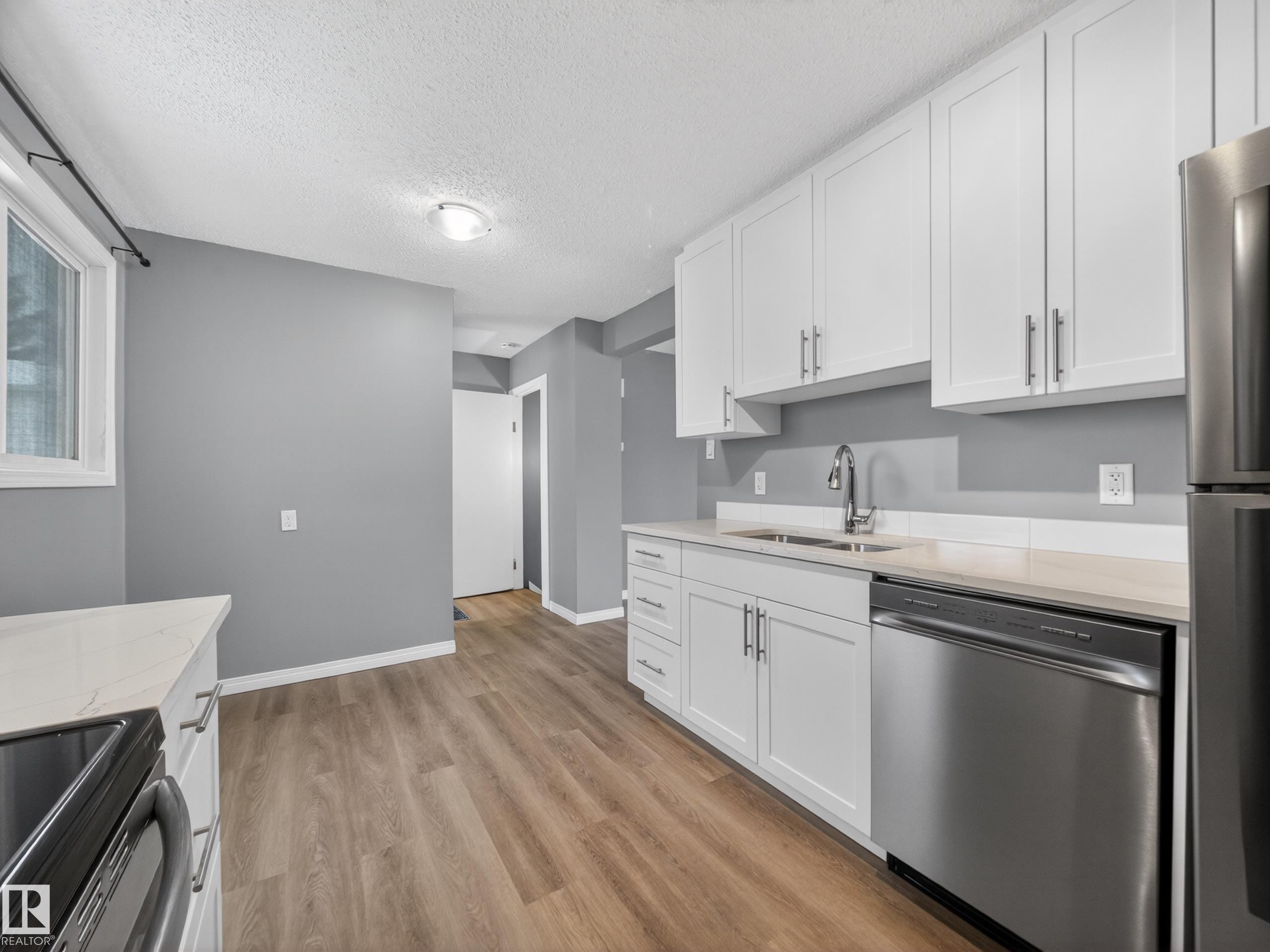 7715 37 Avenue, Edmonton, AB - Indoor Photo Showing Kitchen With Stainless Steel Kitchen