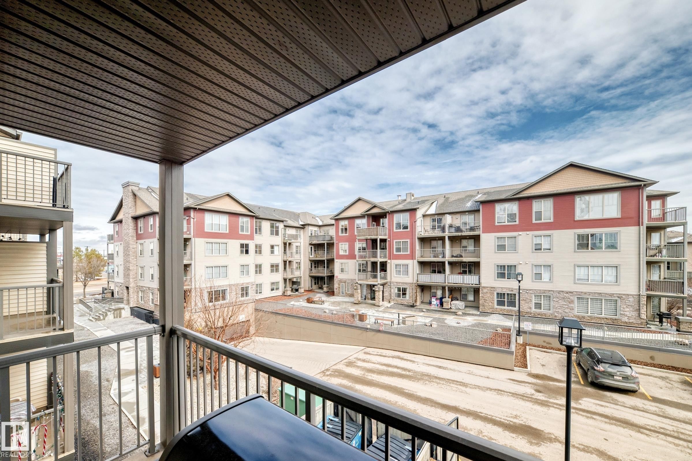 Enjoy the view from the balcony, featuring a metal railing and an overhead covering - 301 103 Ambleside Drive, Edmonton, AB - Outdoor