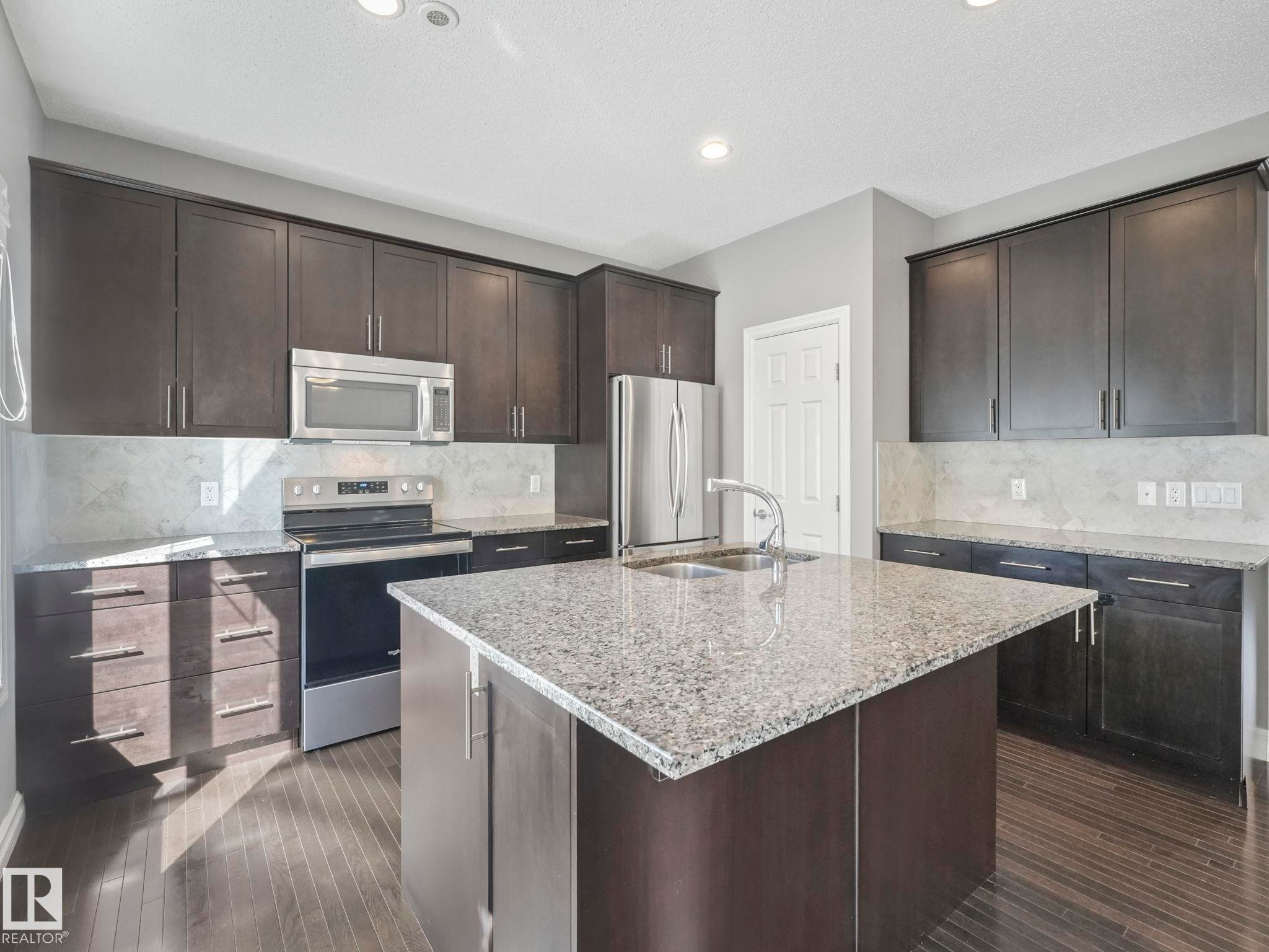 81 2003 Rabbit Hill Road Nw, Edmonton, AB - Indoor Photo Showing Kitchen With Stainless Steel Kitchen With Double Sink With Upgraded Kitchen