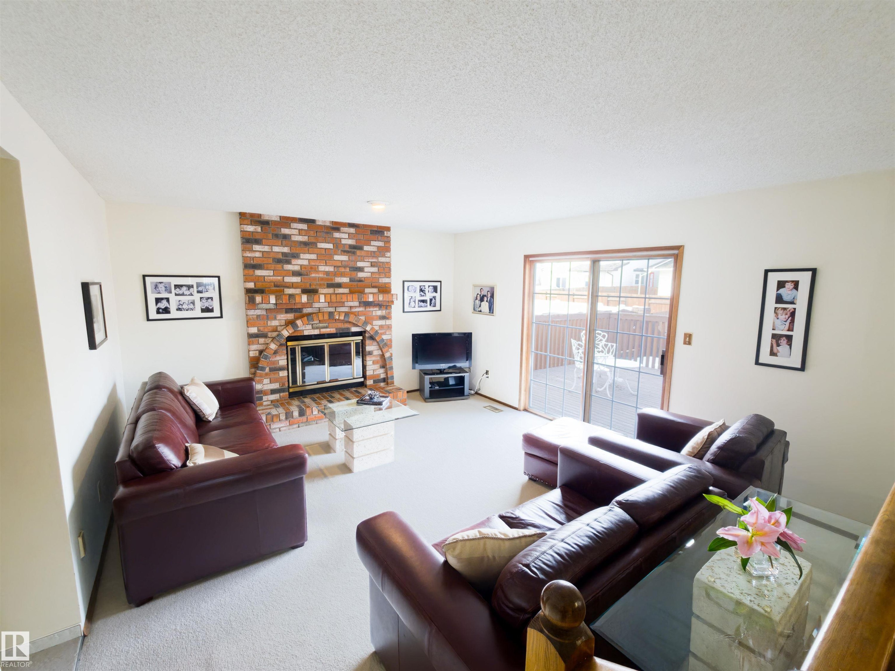 119 Castle Keep, Edmonton, AB - Indoor Photo Showing Living Room With Fireplace