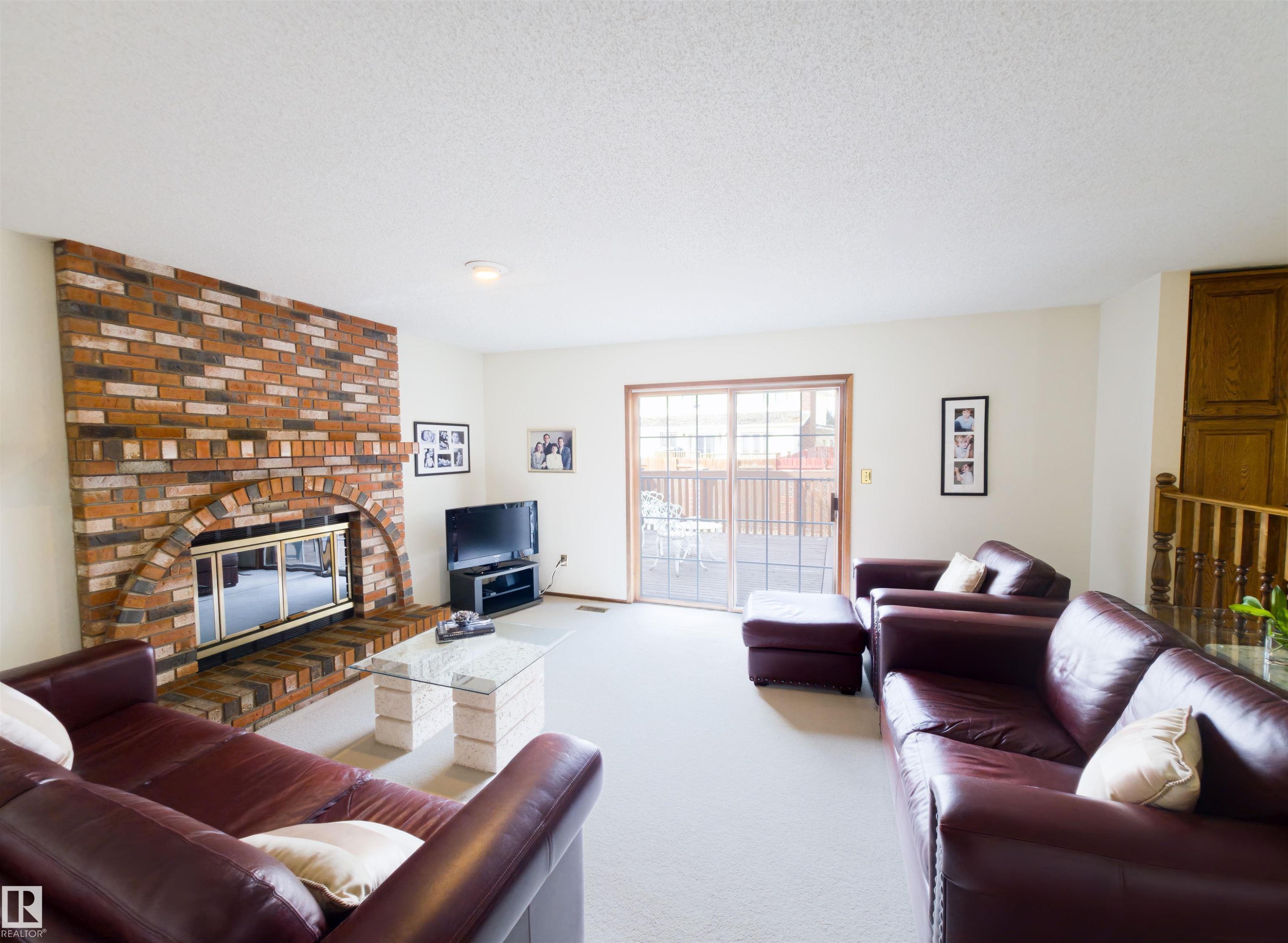119 Castle Keep, Edmonton, AB - Indoor Photo Showing Living Room With Fireplace