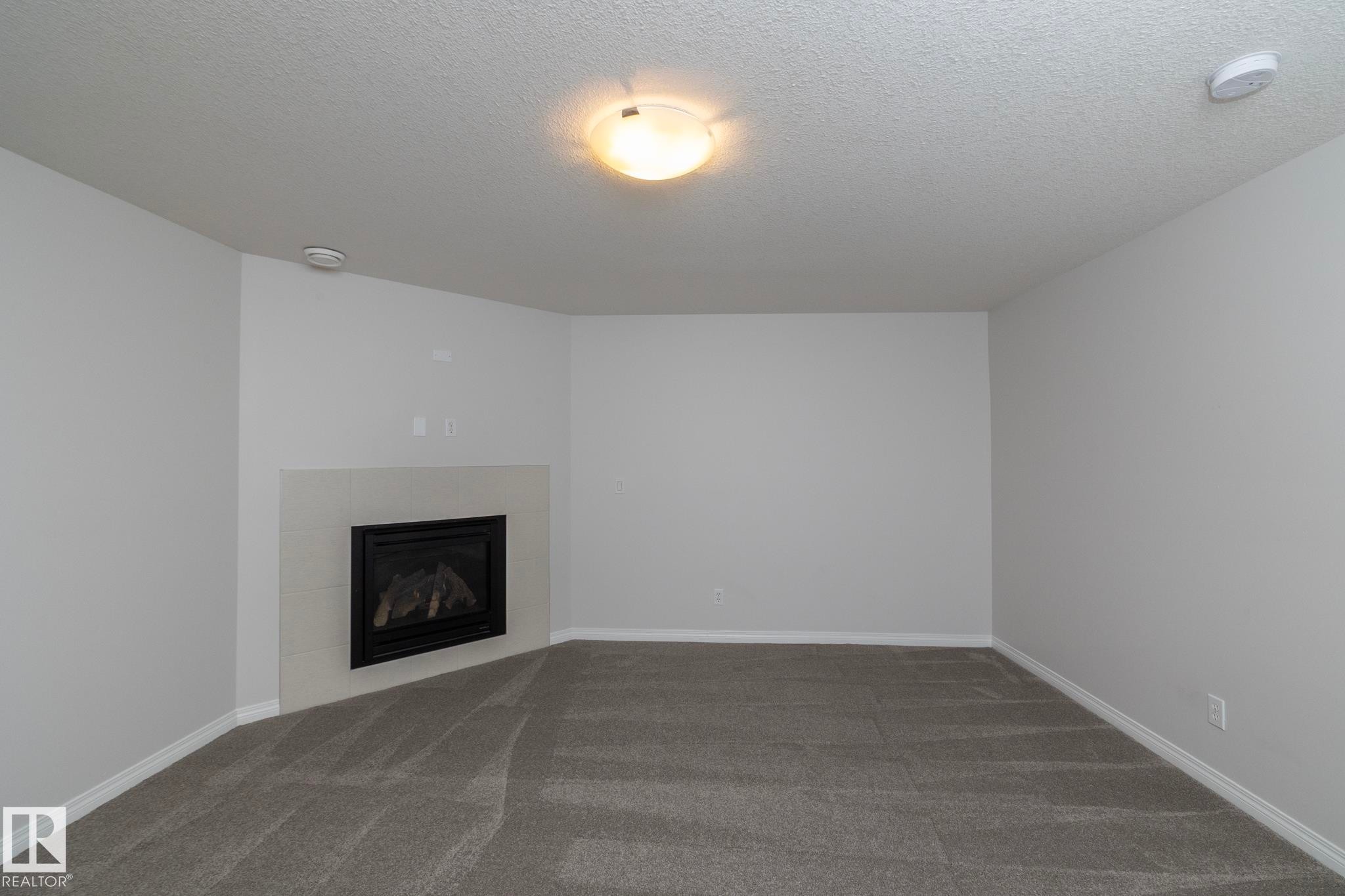 197 Birchwood Close, Devon, AB - Indoor With Fireplace