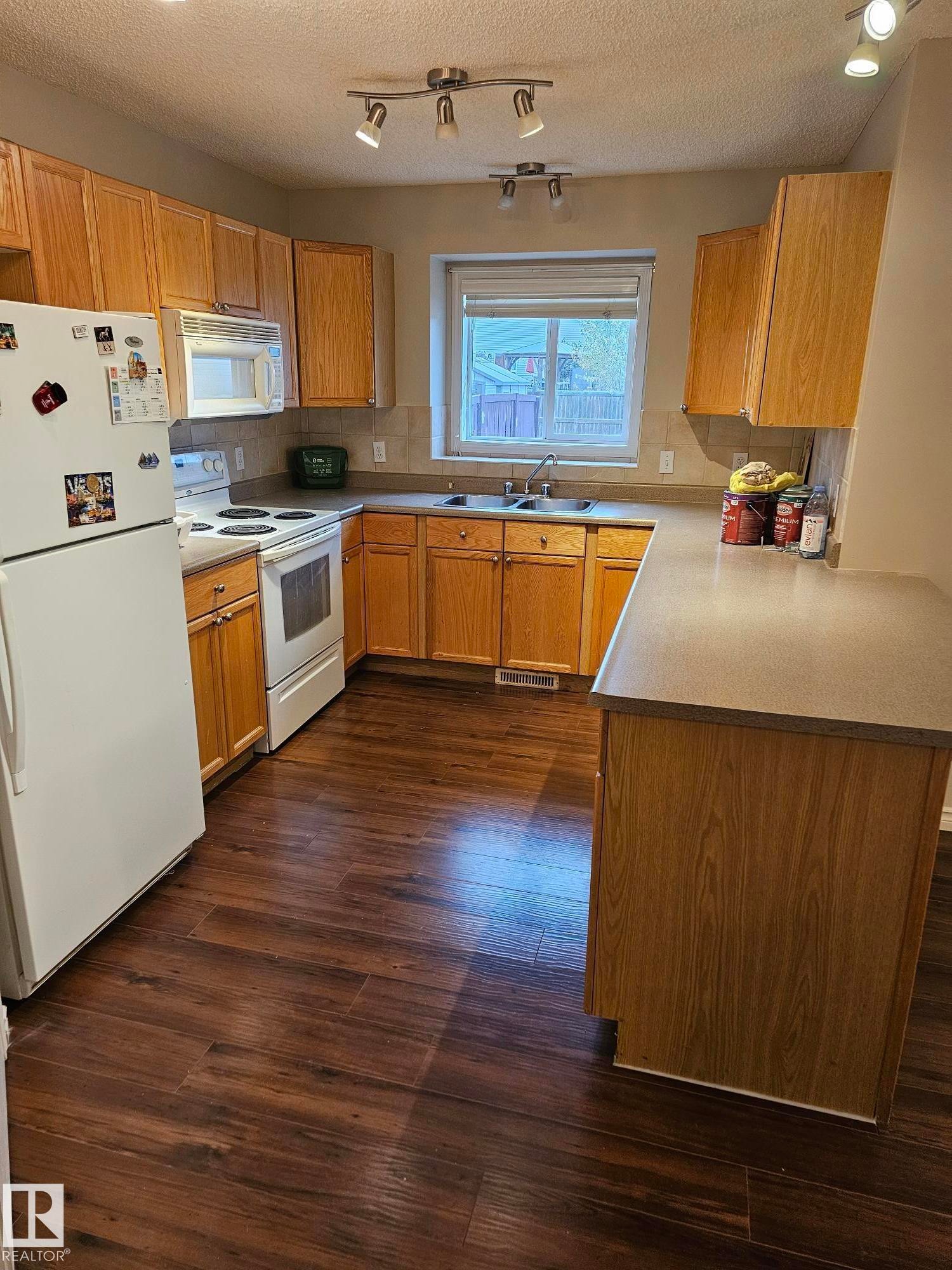 Edmonton, AB - Indoor Photo Showing Kitchen With Double Sink