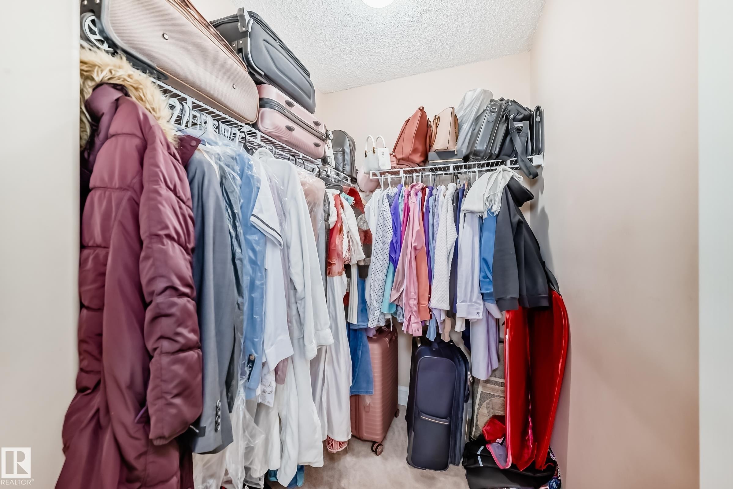 The property features a closet with wire shelving and a hanging rod, providing storage solutions - 11415 167A Avenue Nw, Edmonton, AB - Indoor With Storage