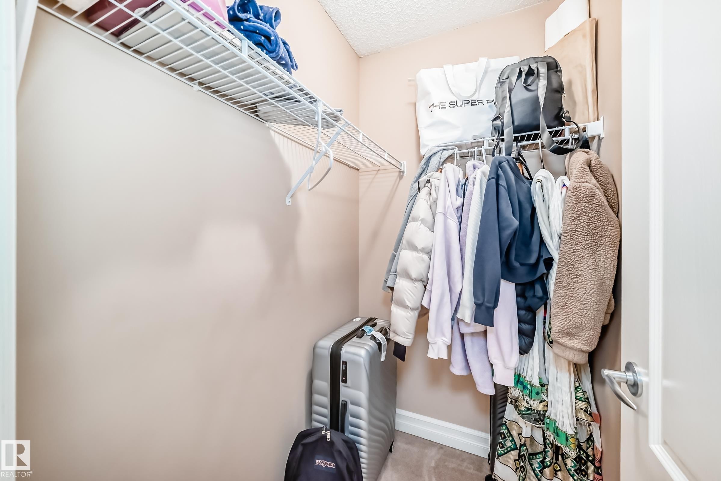 The property features a closet with a wire rack and hanging rod for storage - 11415 167A Avenue Nw, Edmonton, AB - Indoor With Storage