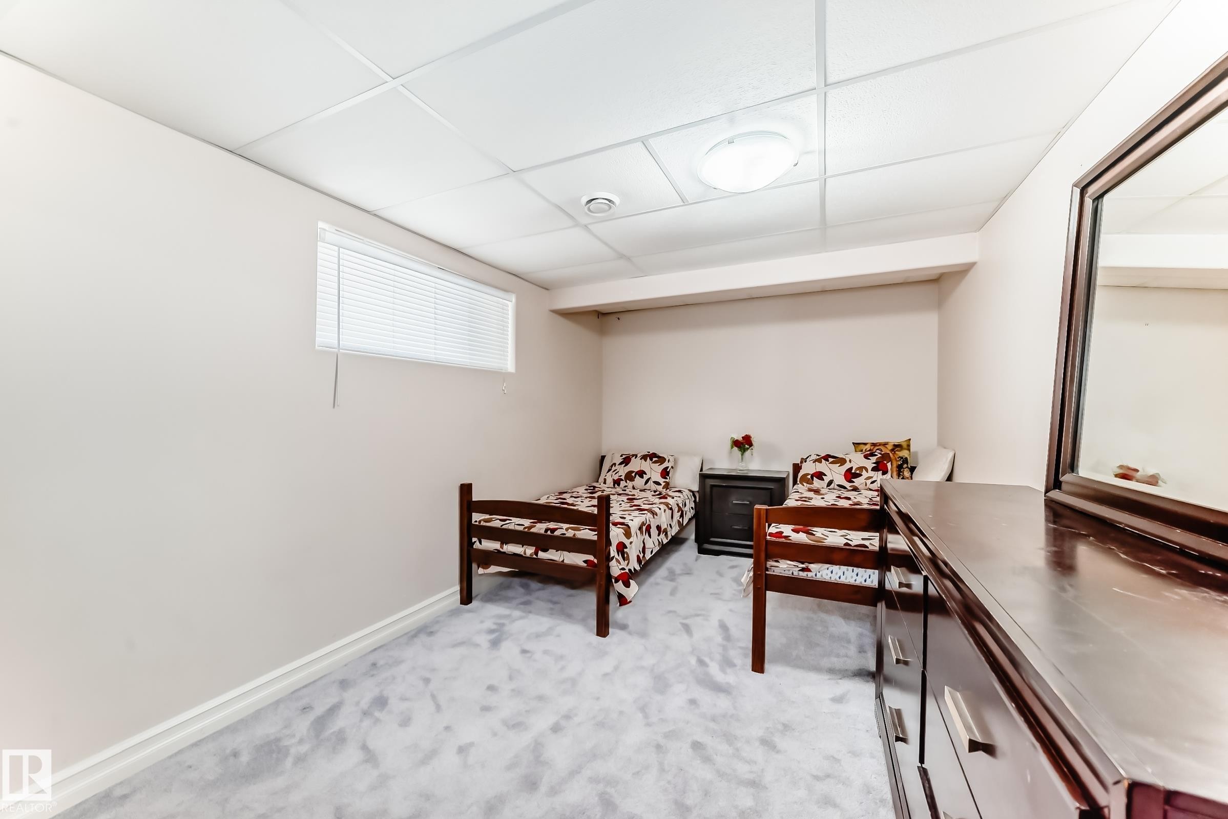 This room features a window with blinds, light-colored walls, and a light-toned carpet - 11415 167A Avenue Nw, Edmonton, AB - Indoor Photo Showing Other Room
