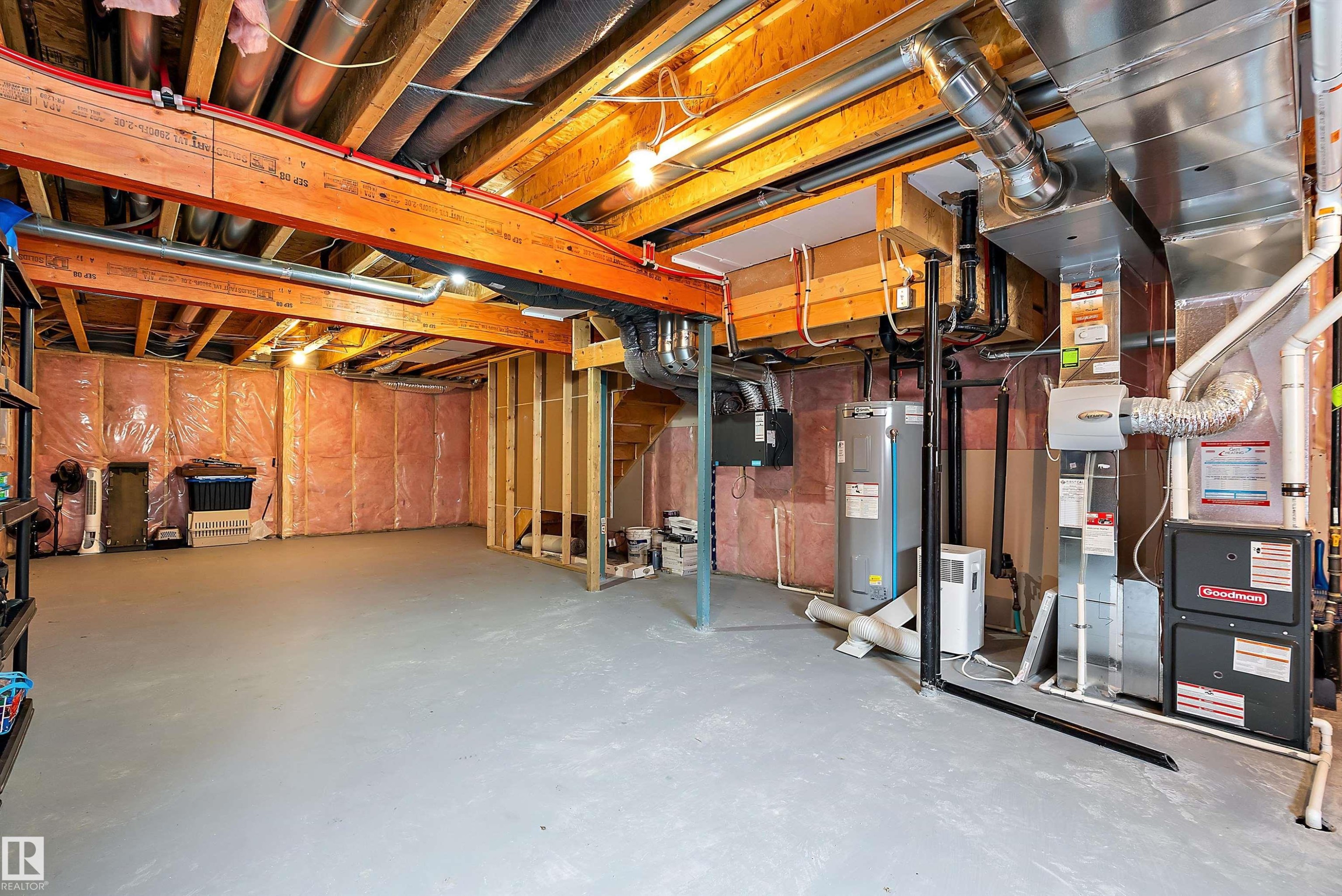 Expansive unfinished basement featuring exposed ceiling joists, insulation, and concrete flooring - 7776 Eifert Crescent Nw, Edmonton, AB - Indoor Photo Showing Basement