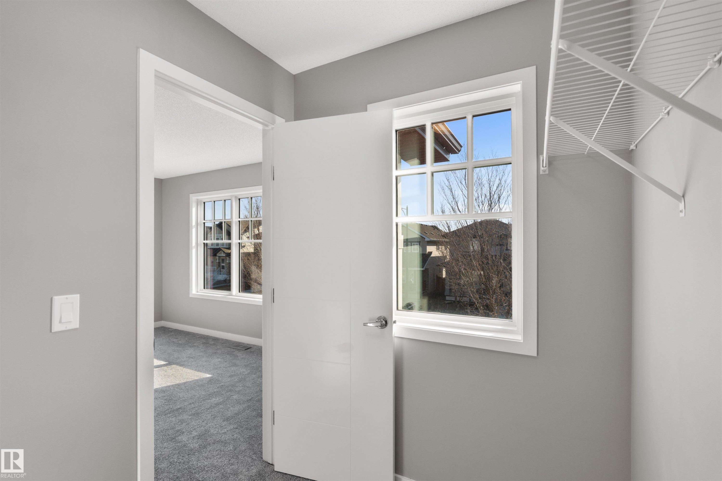 This interior space features light grey walls, a white door frame, and a white interior door - 4016 Allan Crescent, Edmonton, AB - Indoor Photo Showing Other Room