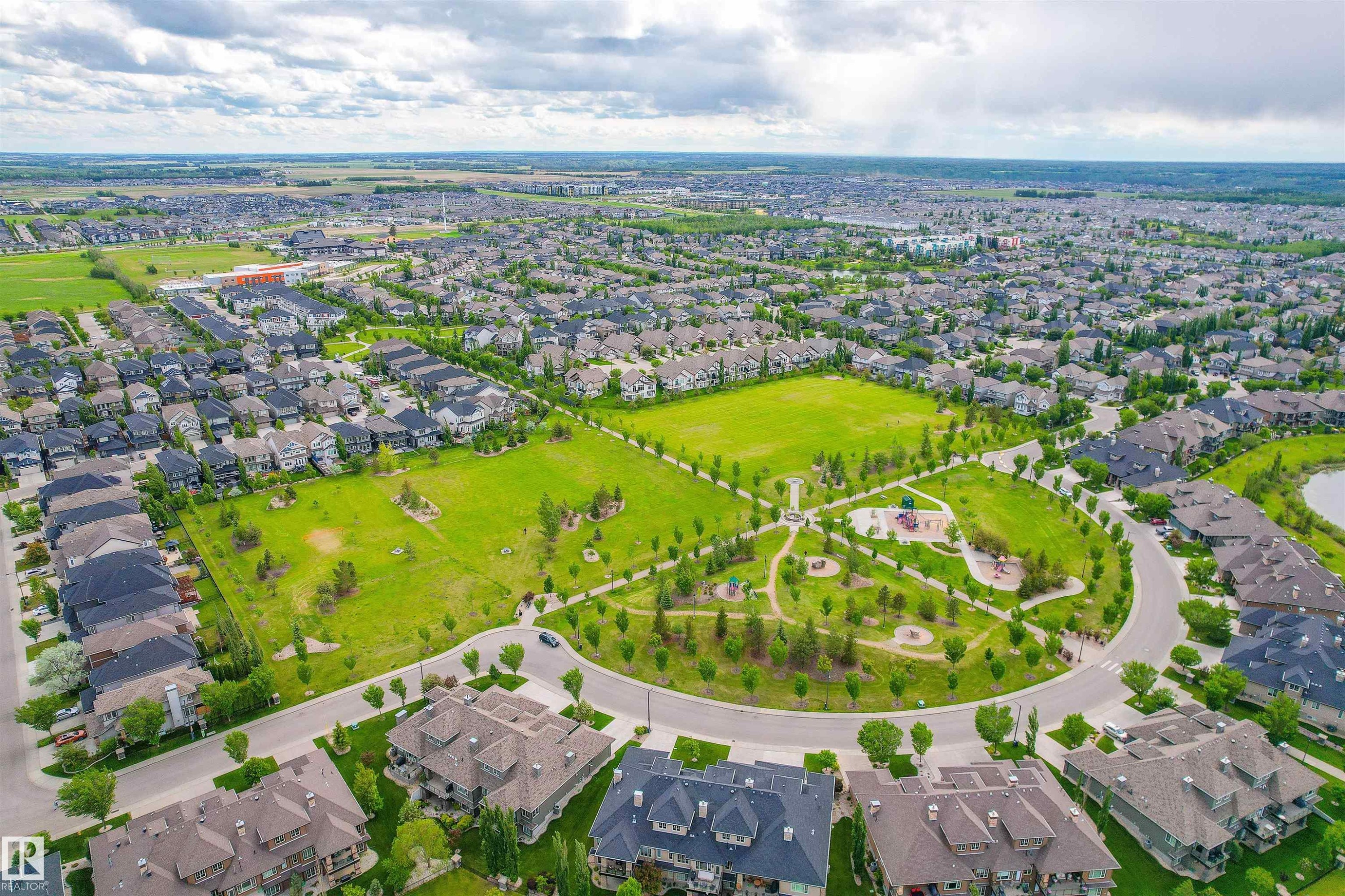 Aerial view of the community, showcasing residential properties, expansive green spaces, and well-maintained roadways - 4016 Allan Crescent, Edmonton, AB - Outdoor With View
