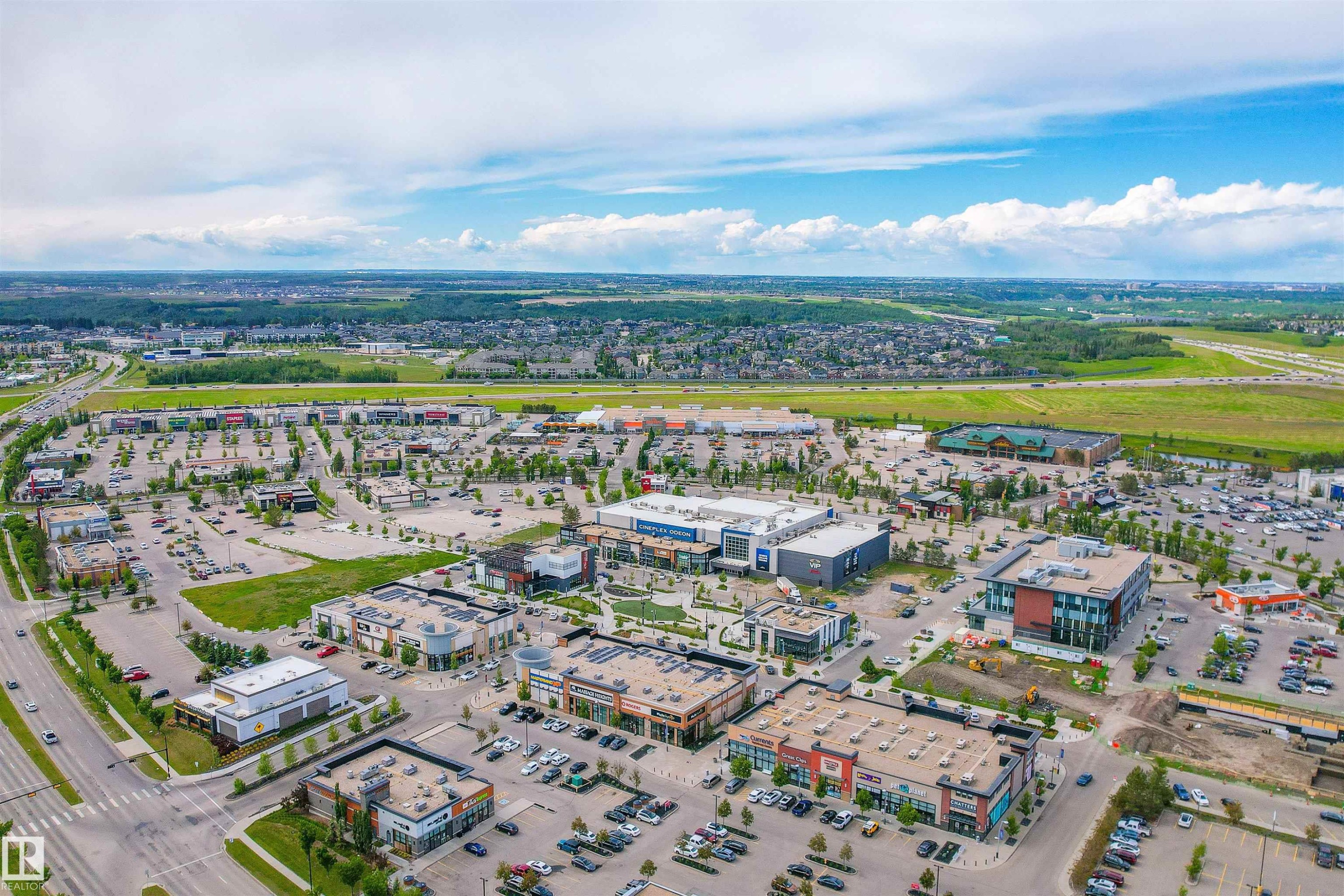 Aerial view of the surrounding community, featuring commercial buildings, parking lots, and roadways - 4016 Allan Crescent, Edmonton, AB - Outdoor With View