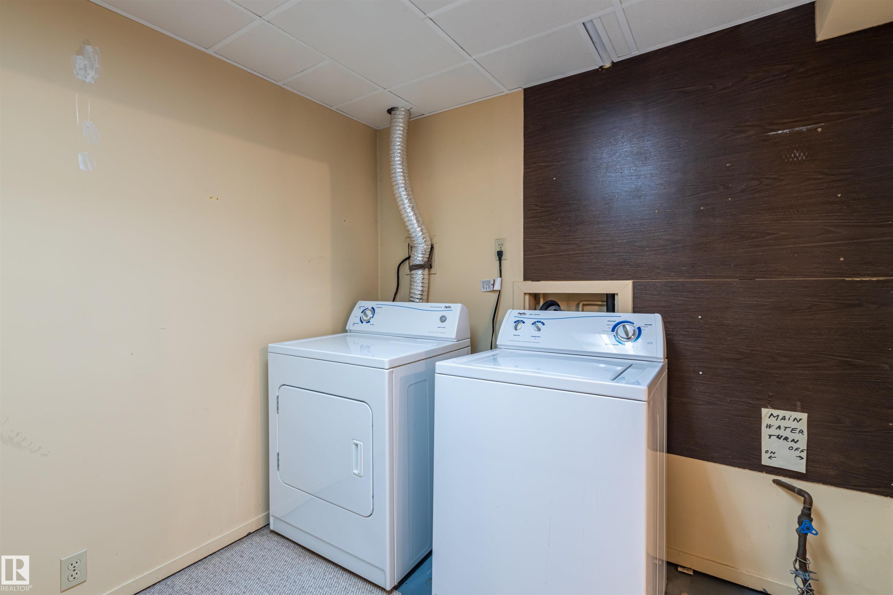 Dedicated laundry area with a washer and dryer - 108 Forest Grove, St. Albert, AB - Indoor Photo Showing Laundry Room