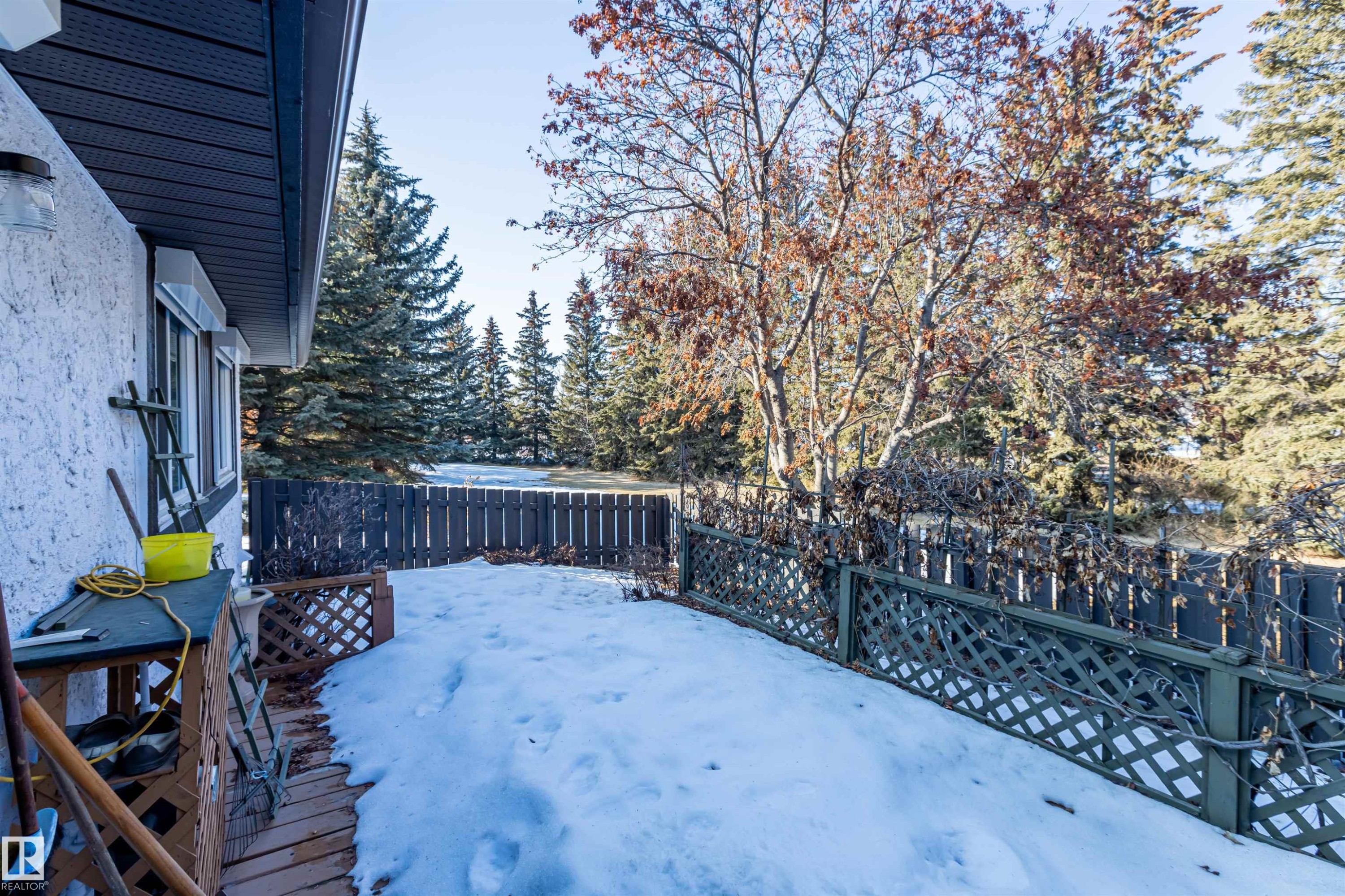 The property features an exterior with textured stucco siding and a dark soffit - 108 Forest Grove, St. Albert, AB - Outdoor
