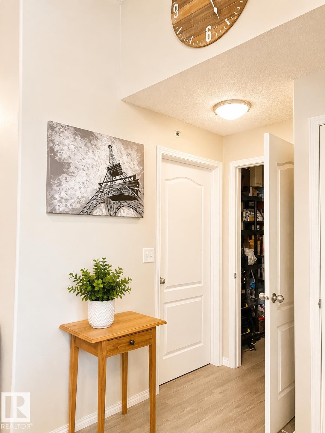 Entryway featuring light neutral wall paint and wood-finish flooring - 336 9525 162 Avenue, Edmonton, AB - Indoor Photo Showing Other Room