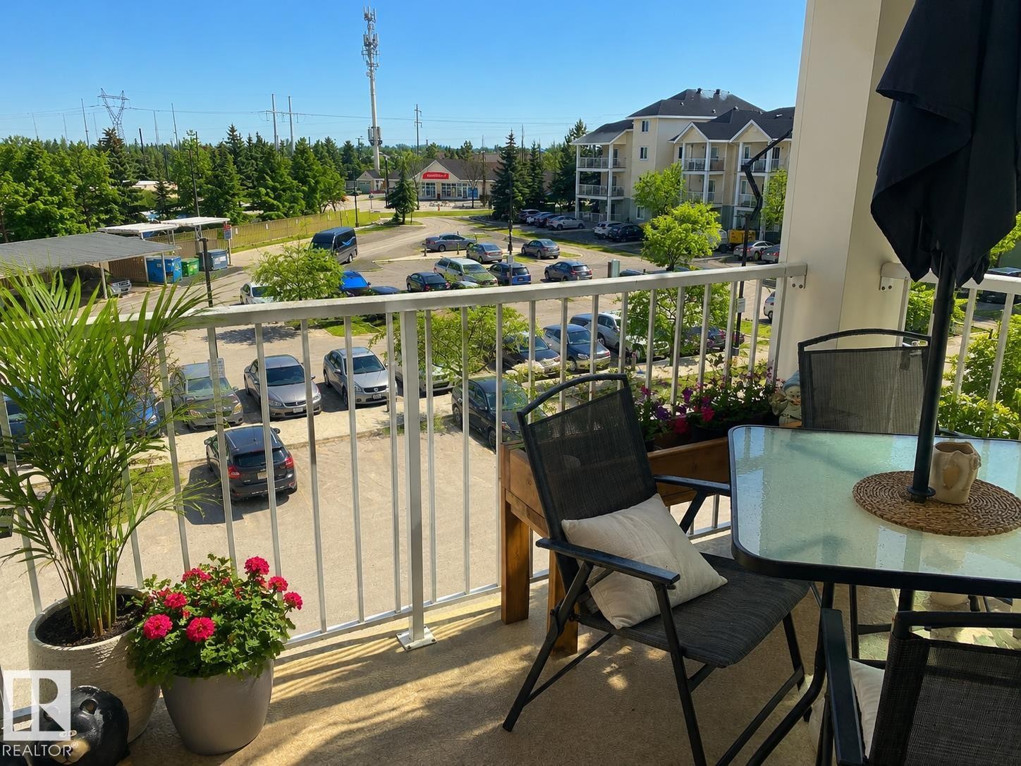 Outdoor balcony with white metal railings and a textured floor - 336 9525 162 Avenue, Edmonton, AB - Outdoor
