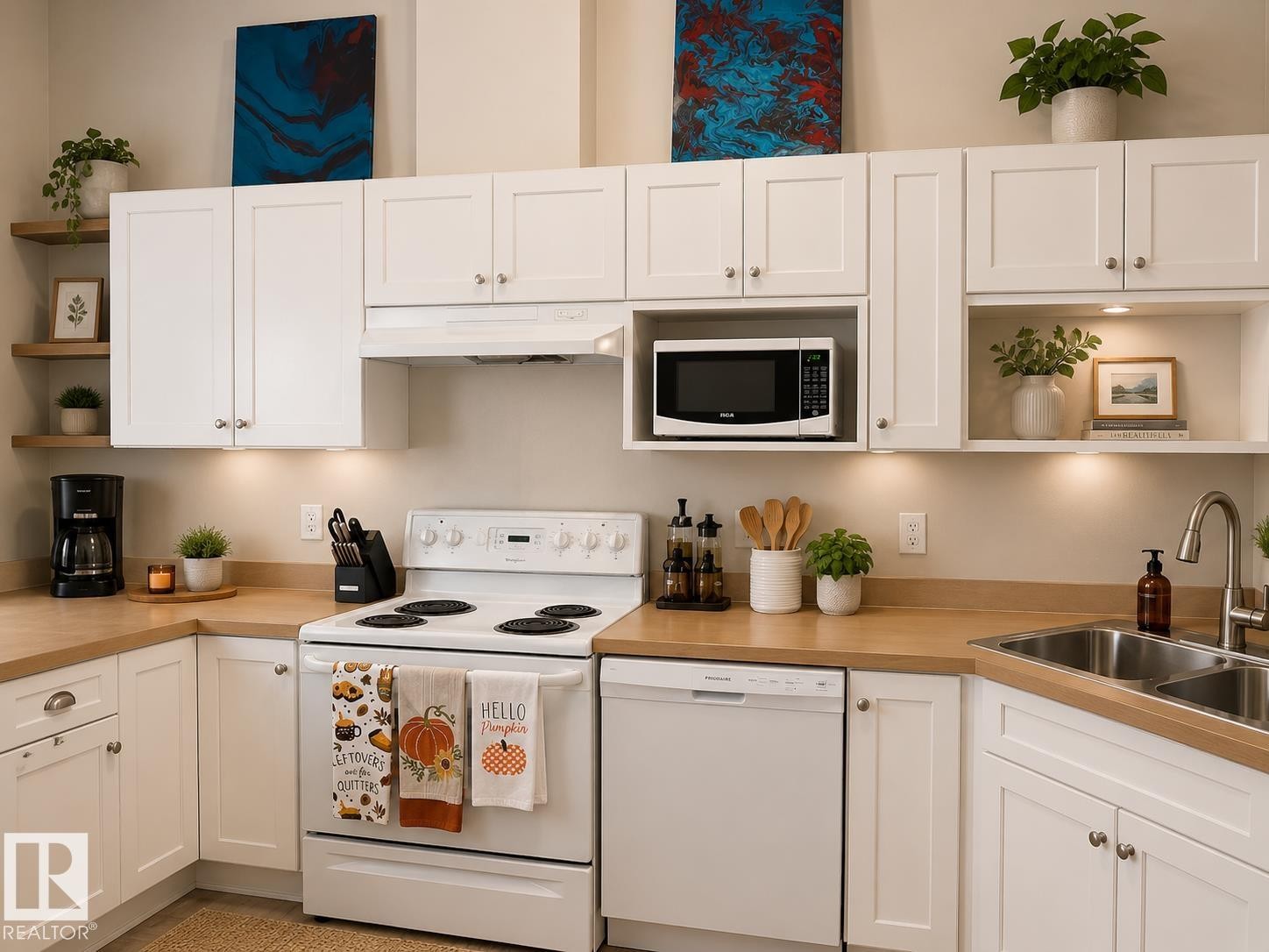 Kitchen featuring white cabinetry, wood-finish countertops, stainless steel double basin sink, and built-in microwave - 336 9525 162 Avenue, Edmonton, AB - Indoor Photo Showing Kitchen With Double Sink