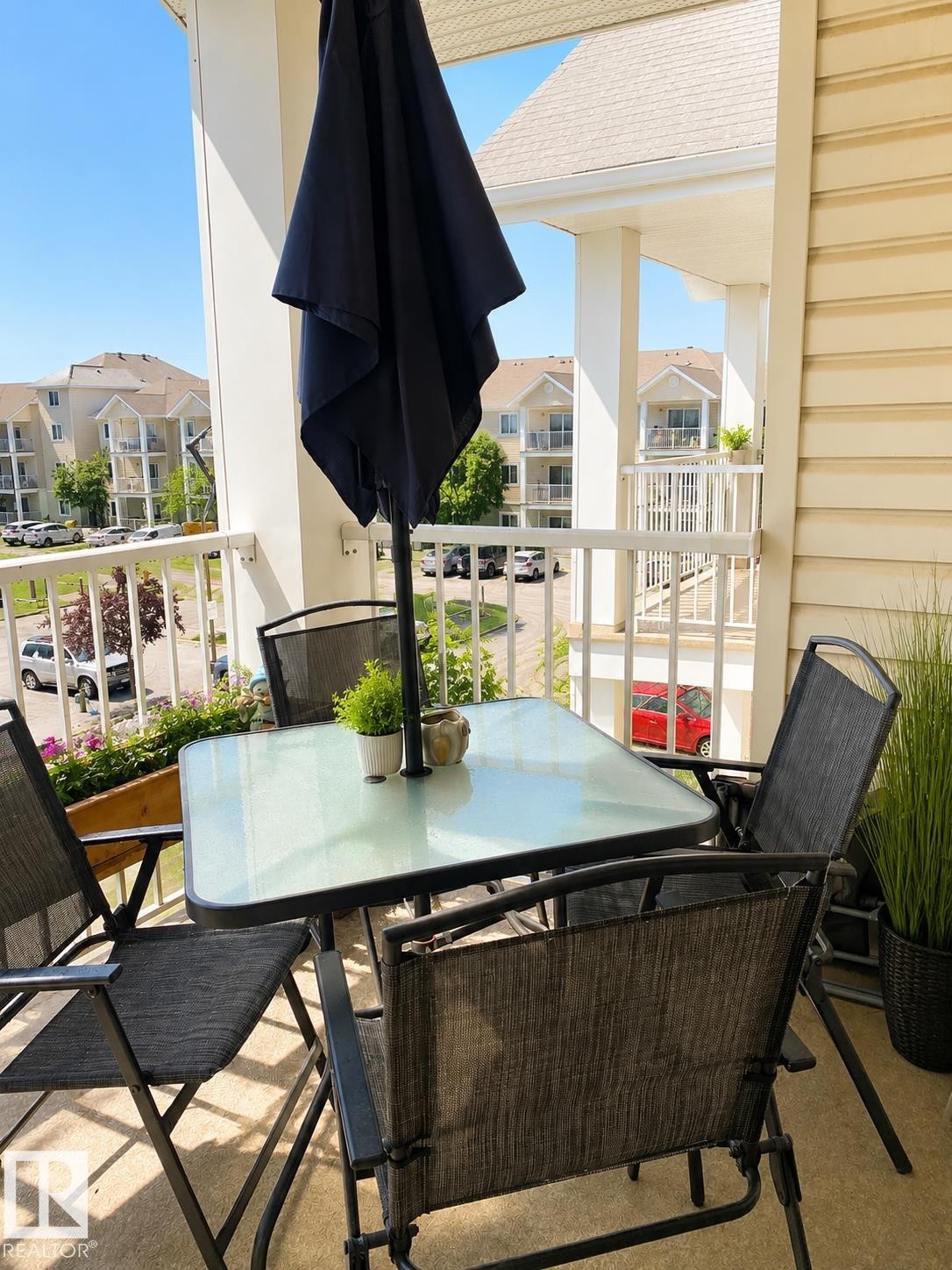 Expansive balcony featuring a planter box, white railing, and exterior wall siding - 336 9525 162 Avenue, Edmonton, AB - Outdoor With Exterior