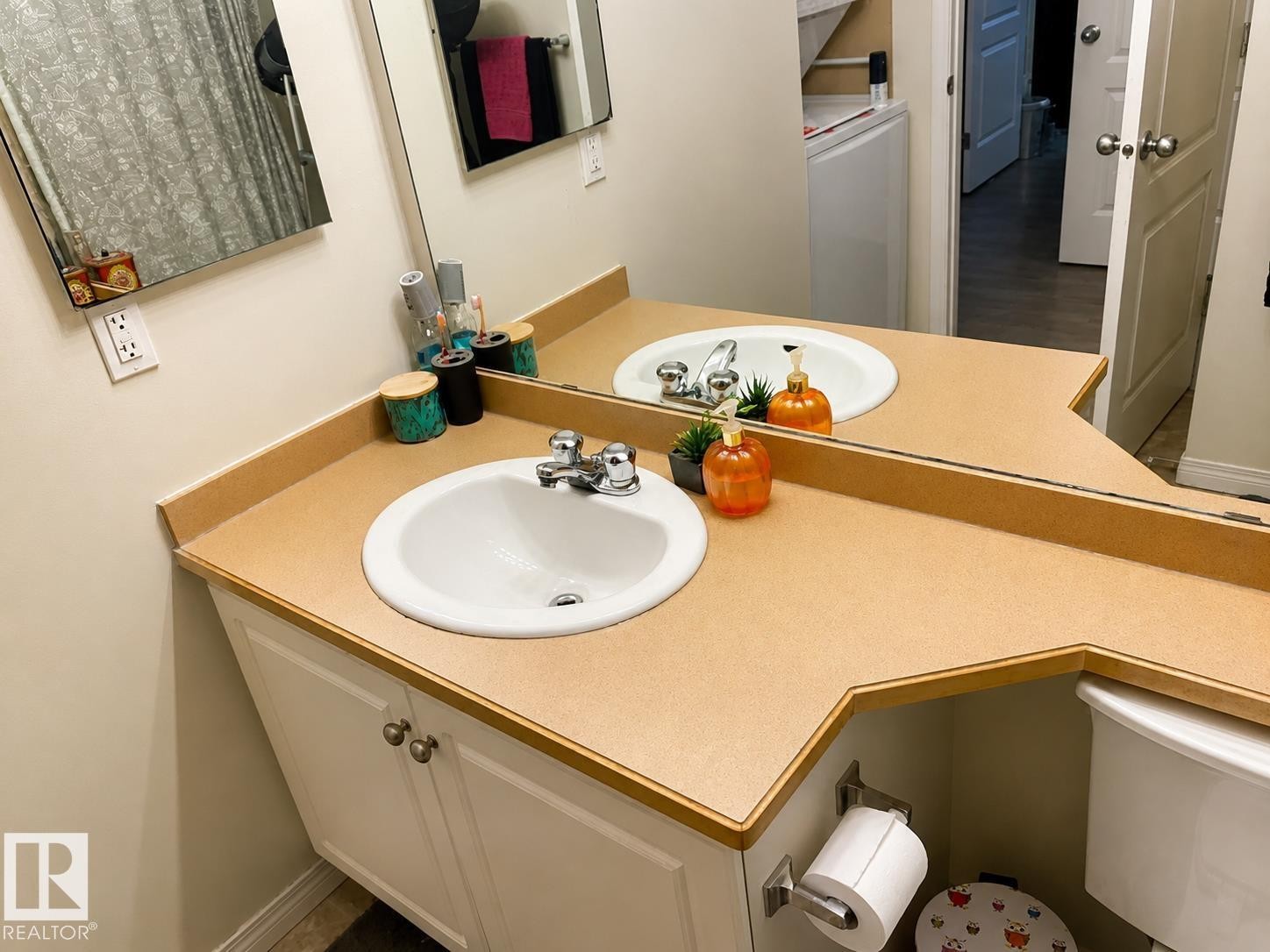 Dual sink vanity with a light-toned countertop and integrated white basins - 336 9525 162 Avenue, Edmonton, AB - Indoor Photo Showing Bathroom