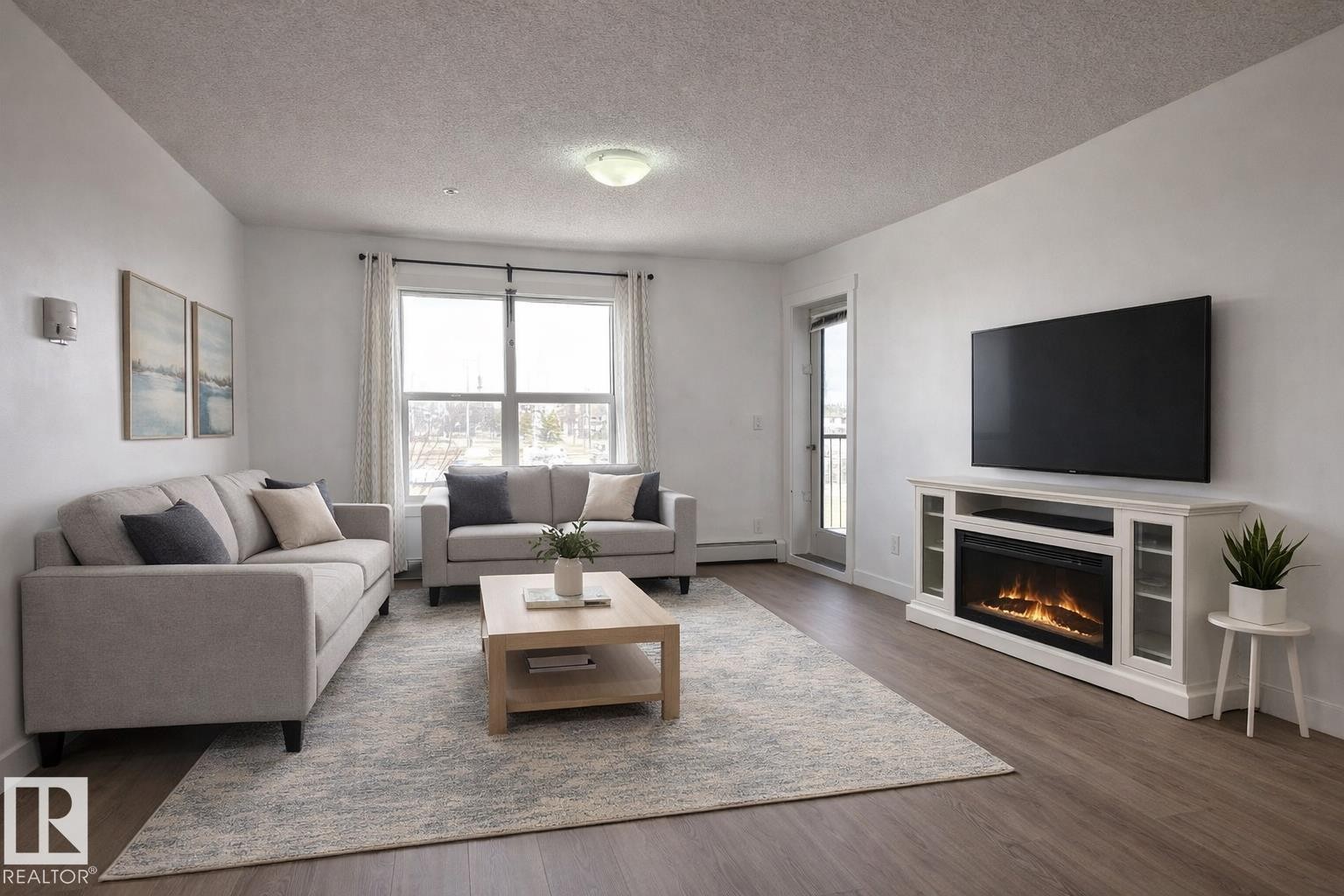 311 667 Watt Boulevard, Edmonton, AB - Indoor Photo Showing Living Room With Fireplace