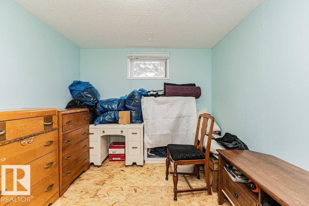 This room features light blue walls and a window providing natural light - 8 Duke Drive, Lamont, AB - Indoor
