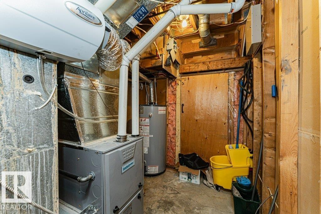 The property features a utility room equipped with a furnace and water heater - 8 Duke Drive, Lamont, AB - Indoor Photo Showing Basement