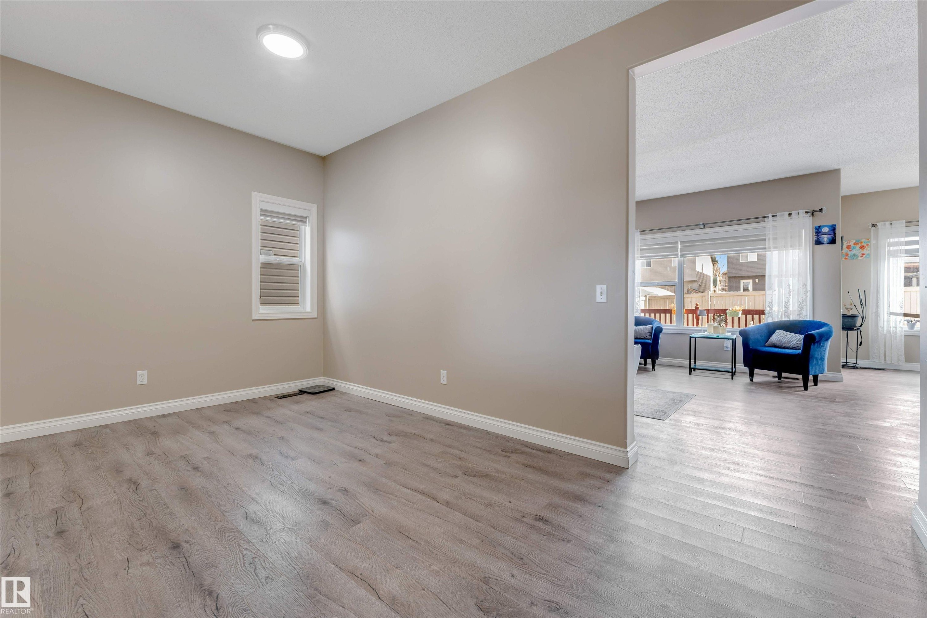 This versatile room features light-colored walls, a window with blinds, and recessed lighting - 121 64 Street, Edmonton, AB - Indoor Photo Showing Other Room