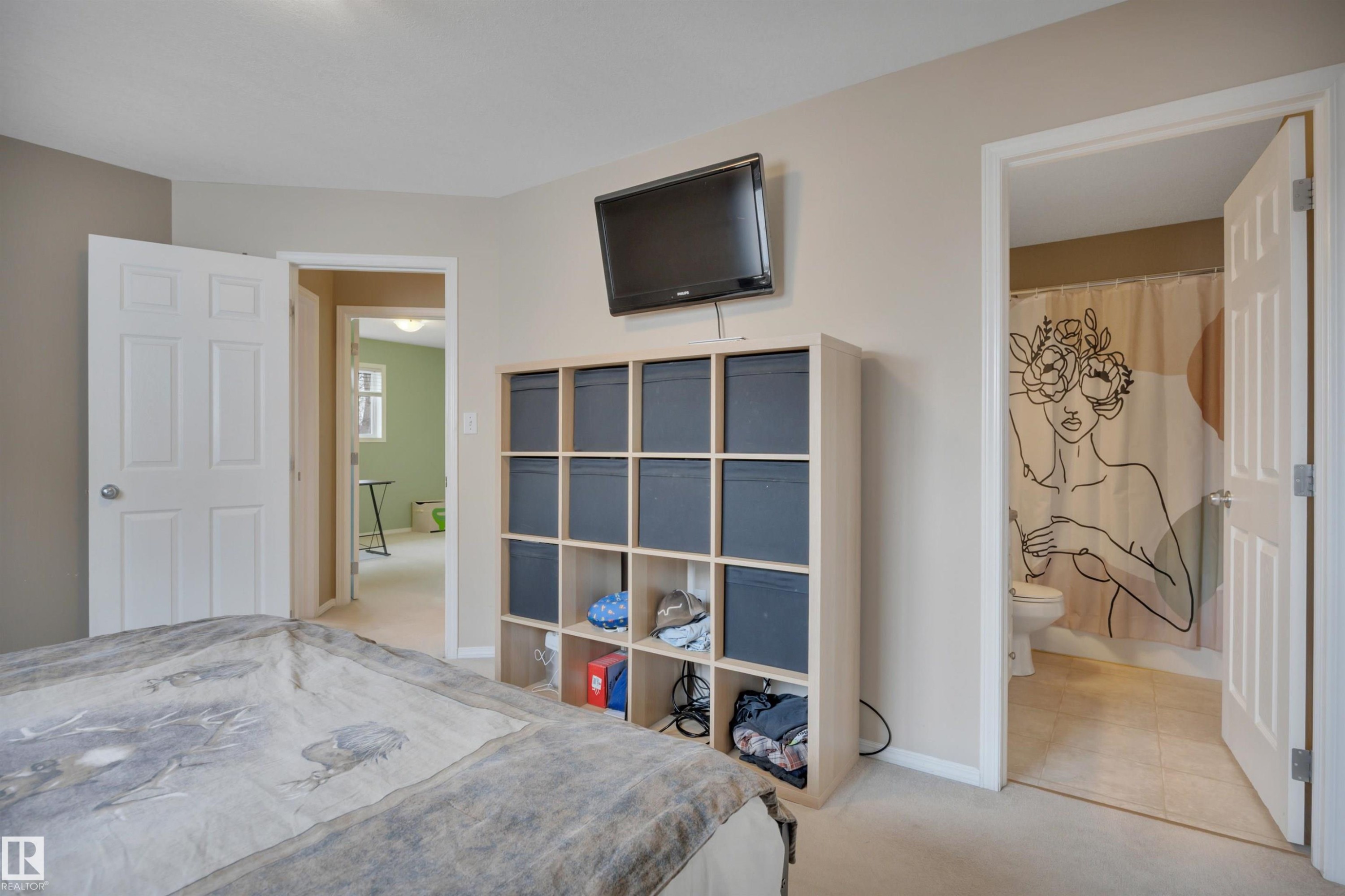The room features neutral-toned walls and carpeted flooring - 5 Parkview Crescent, Calmar, AB - Indoor Photo Showing Bedroom