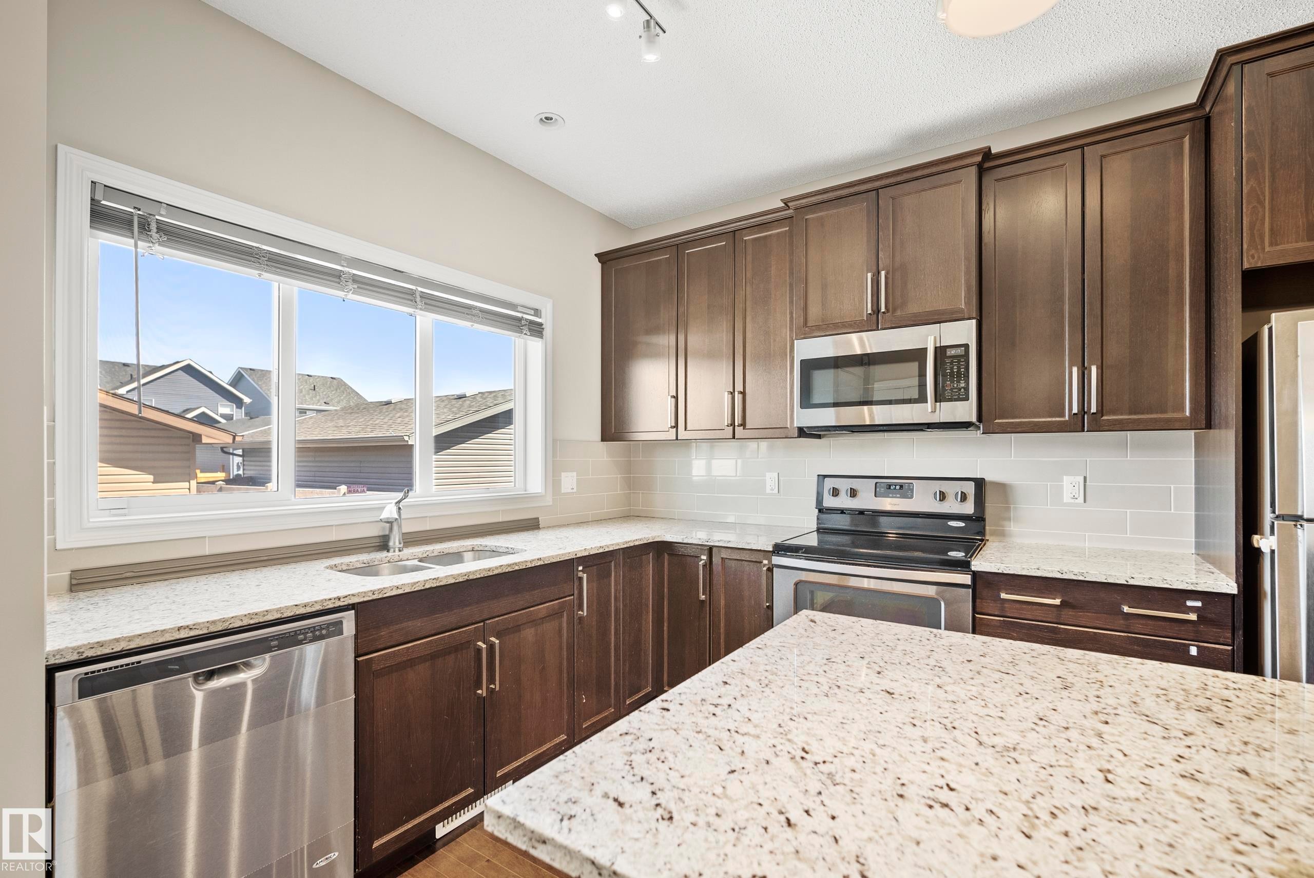 17625 60A Street, Edmonton, AB - Indoor Photo Showing Kitchen With Double Sink