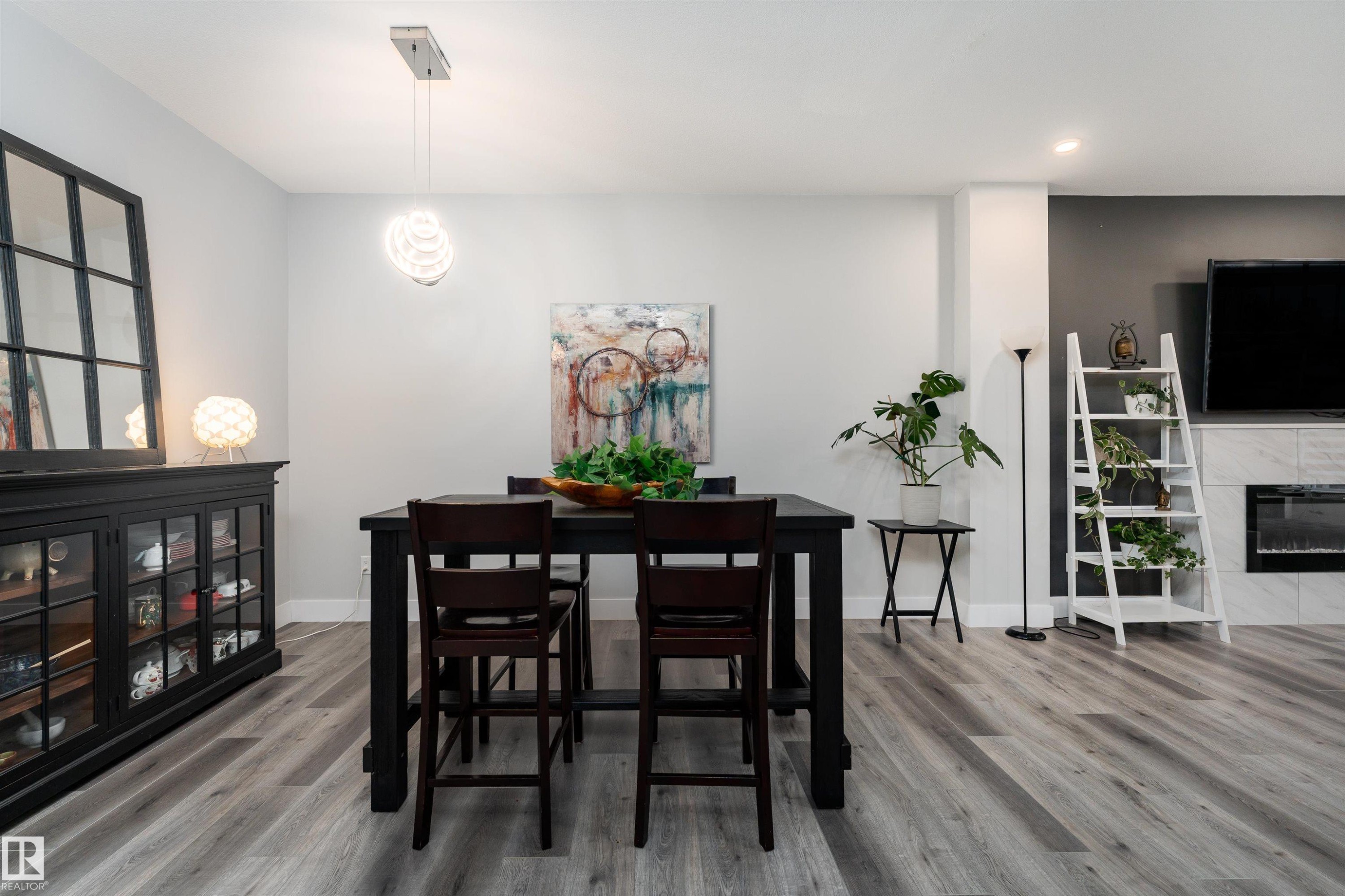 9338 Pear Link, Edmonton, AB - Indoor Photo Showing Dining Room With Fireplace