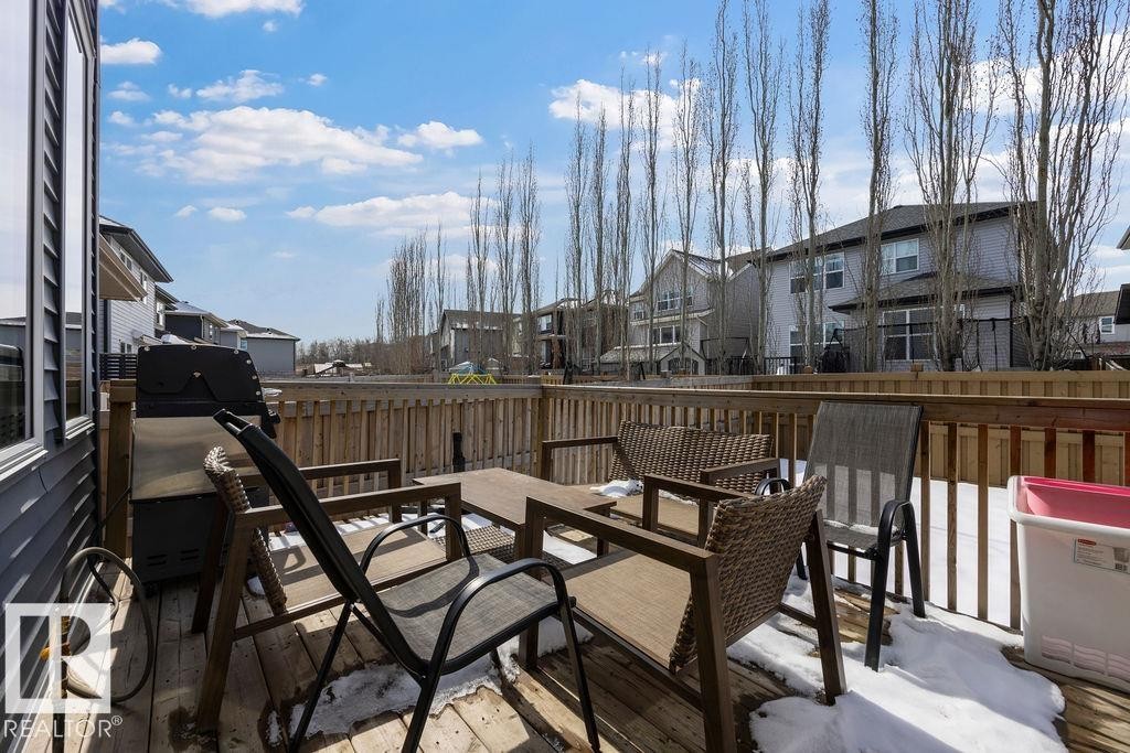 The property includes a spacious wooden deck, ideal for outdoor gatherings - 17534 60A Street, Edmonton, AB - Outdoor With Deck Patio Veranda