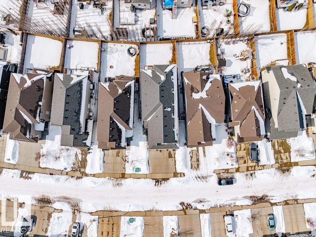 Aerial view of a residential area featuring properties with pitched roofs, individual driveways, and fenced backyards - 17534 60A Street, Edmonton, AB - Indoor Photo Showing Gym Room