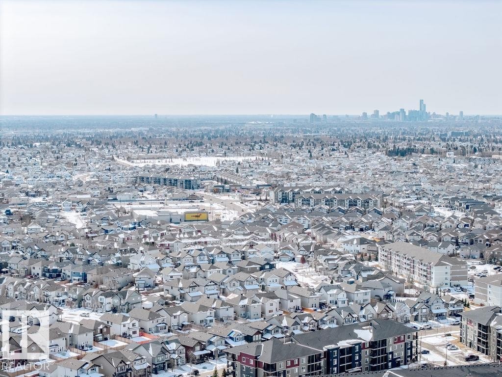 Aerial view of a residential neighbourhood with a cityscape visible in the distance - 17534 60A Street, Edmonton, AB - Outdoor With View