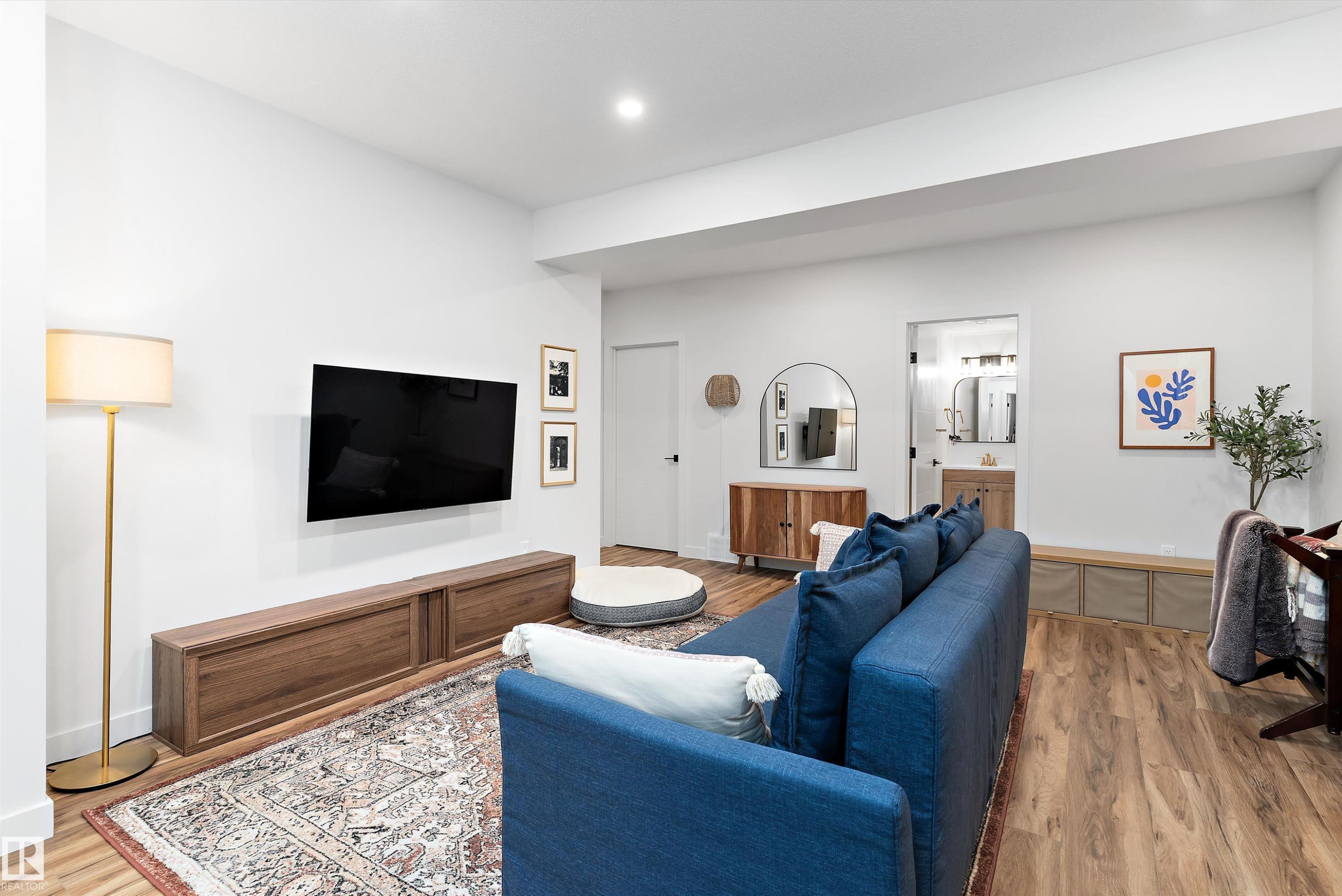 Living area featuring light wood flooring and white walls, with a recessed ceiling light - 1305 Enright Landing, Edmonton, AB - Indoor Photo Showing Living Room