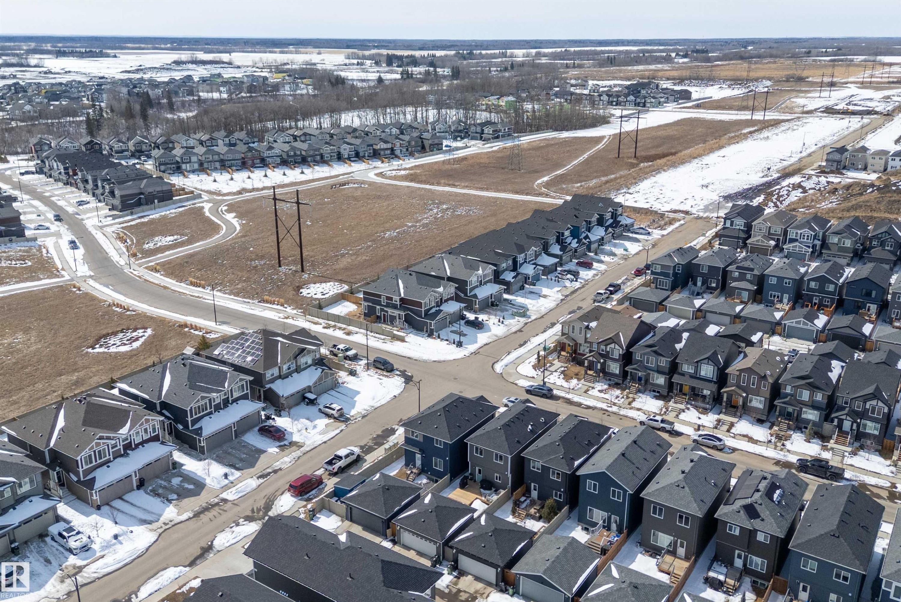 Aerial view showcasing the residential community with detached and attached homes - 1305 Enright Landing, Edmonton, AB - Outdoor With View