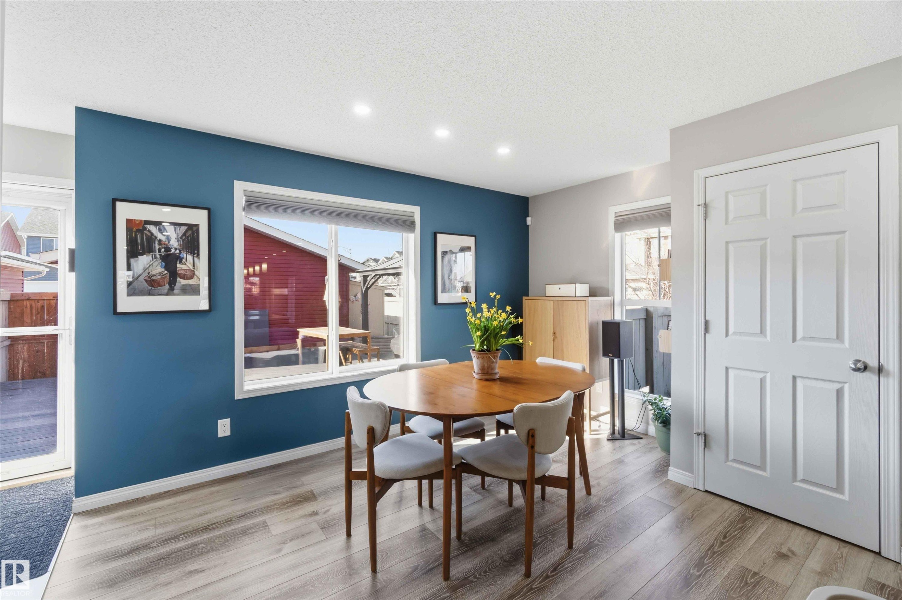 Dining area featuring light-toned flooring, recessed lighting, and a window providing natural light - 4750 Crabapple Run, Edmonton, AB - Indoor Photo Showing Dining Room