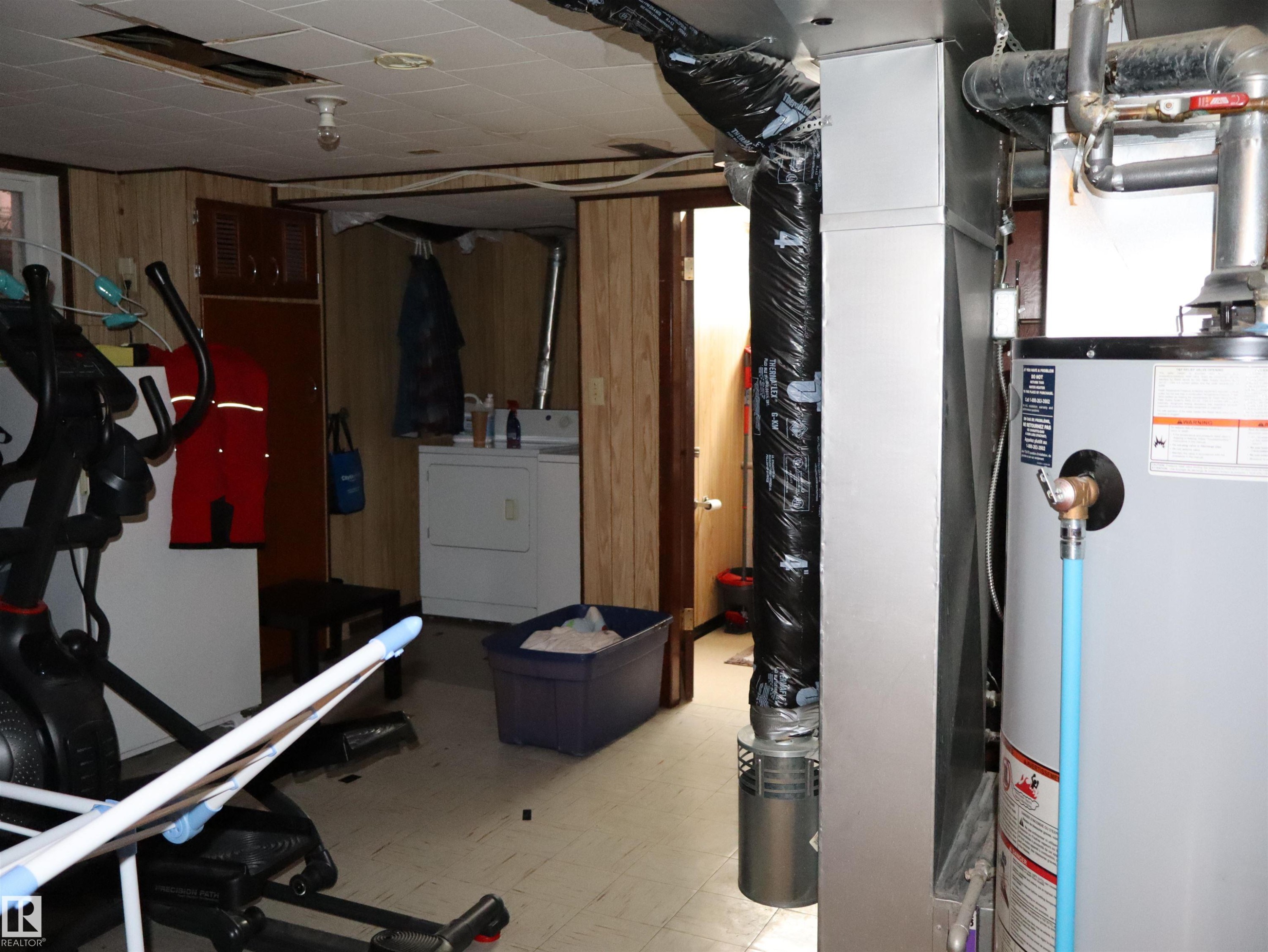 The property includes a water heater and a washer and dryer - 4315 56 Avenue, Barrhead, AB - Indoor Photo Showing Other Room