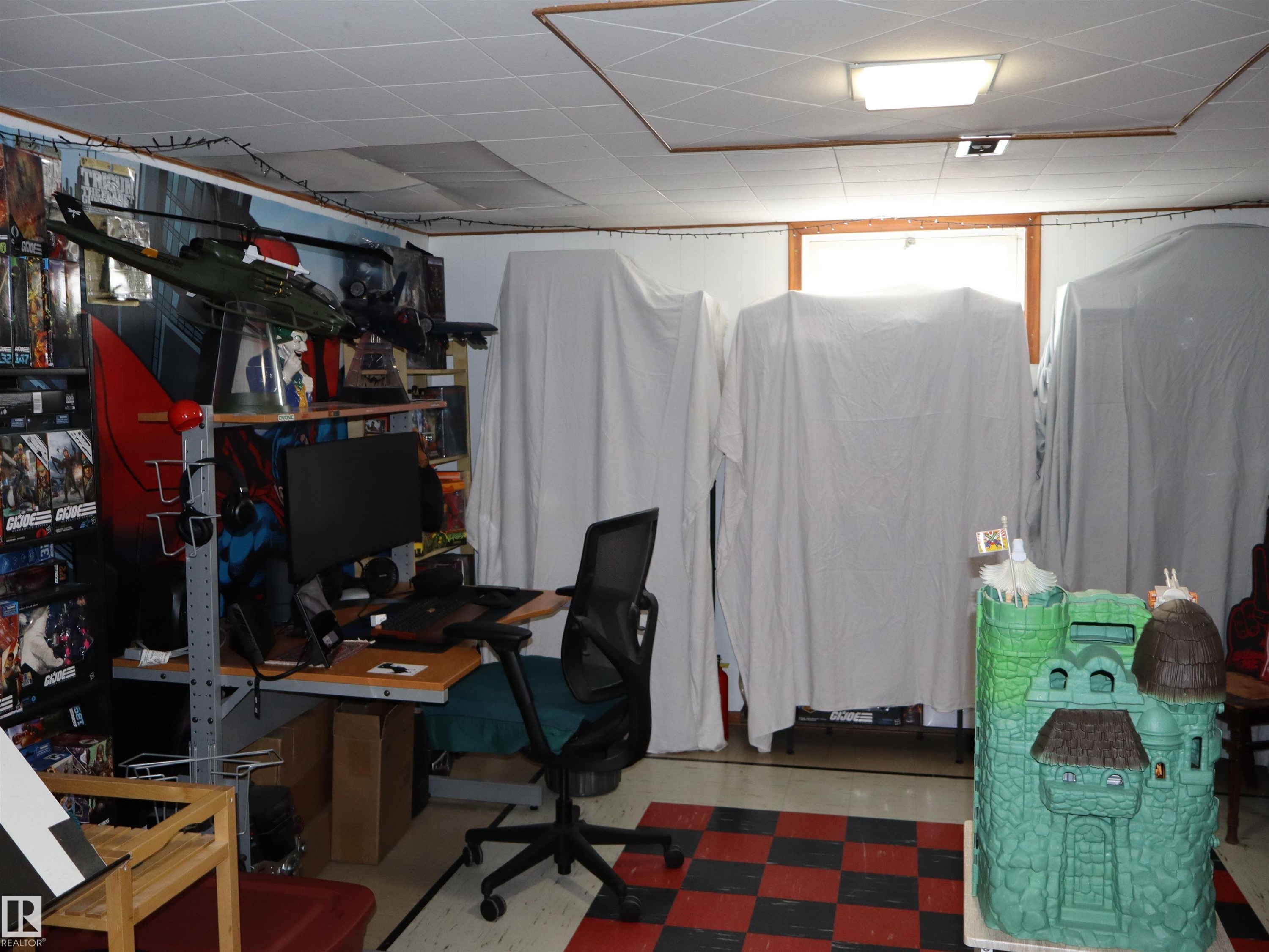 This room features a drop ceiling with recessed lighting and a window providing natural light - 4315 56 Avenue, Barrhead, AB - Indoor