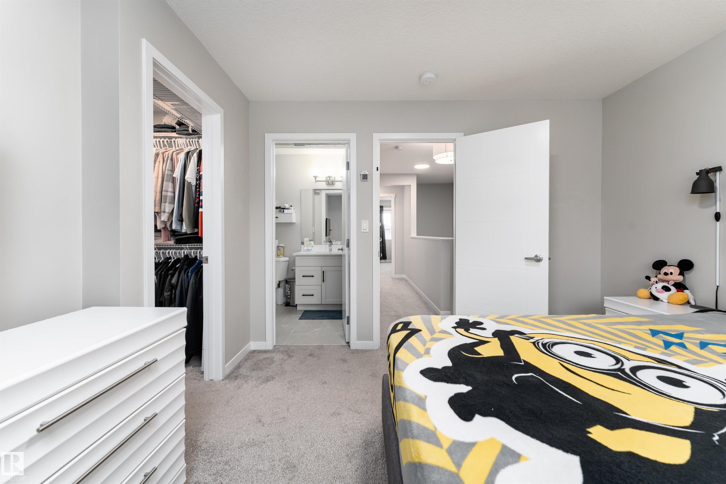 The room features light gray walls, light gray carpet flooring, and white trim - 22742 95A Ave, Edmonton, AB - Indoor Photo Showing Bedroom