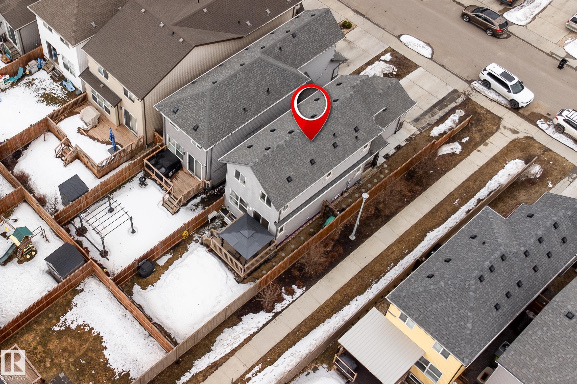 The property features a private backyard with a wooden deck and a covered gazebo - 22742 95A Ave, Edmonton, AB - Photo Showing Other Room
