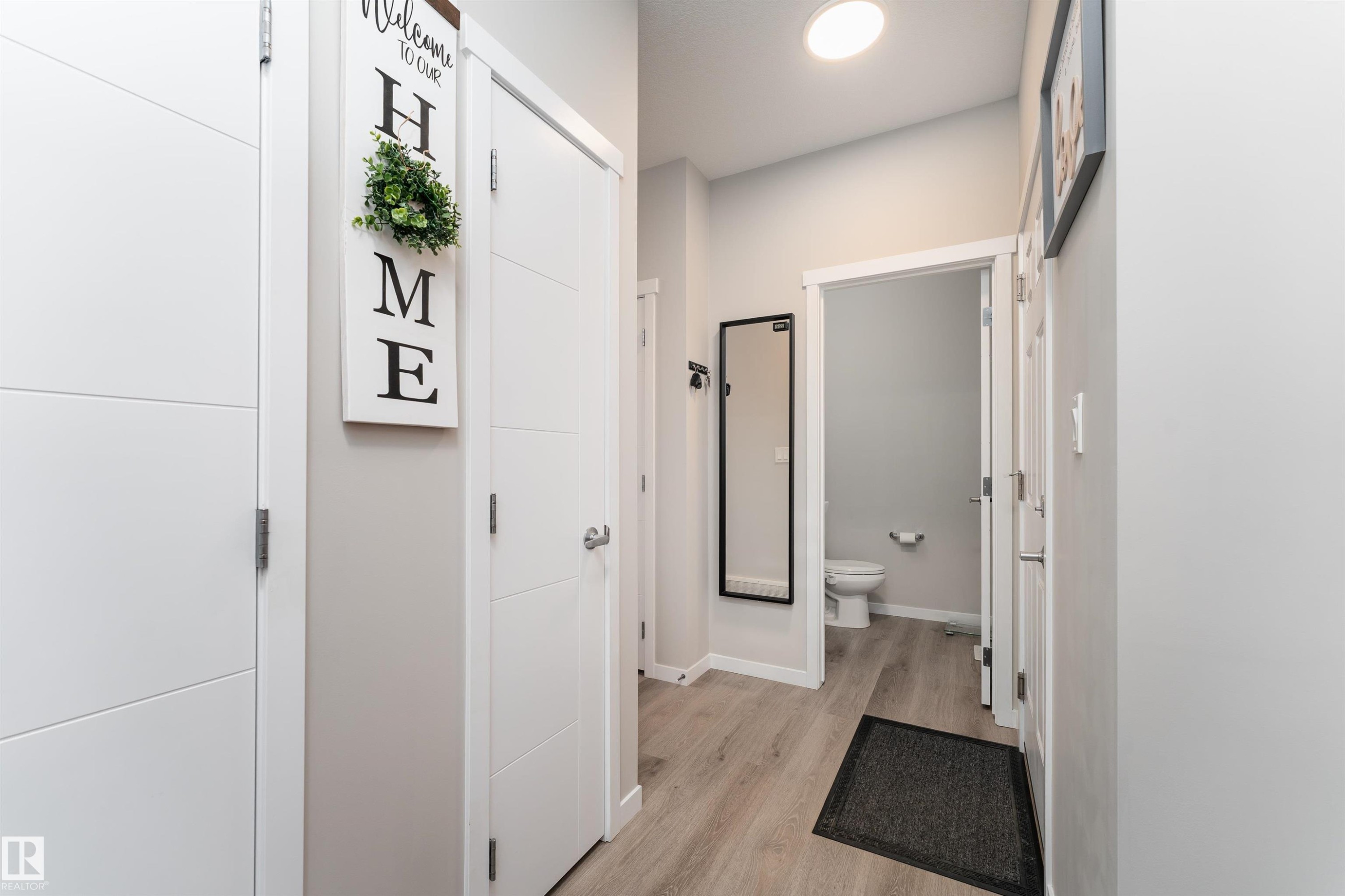 The property features light-colored walls, contemporary white doors, and a ceiling light fixture - 22742 95A Ave, Edmonton, AB - Indoor Photo Showing Other Room