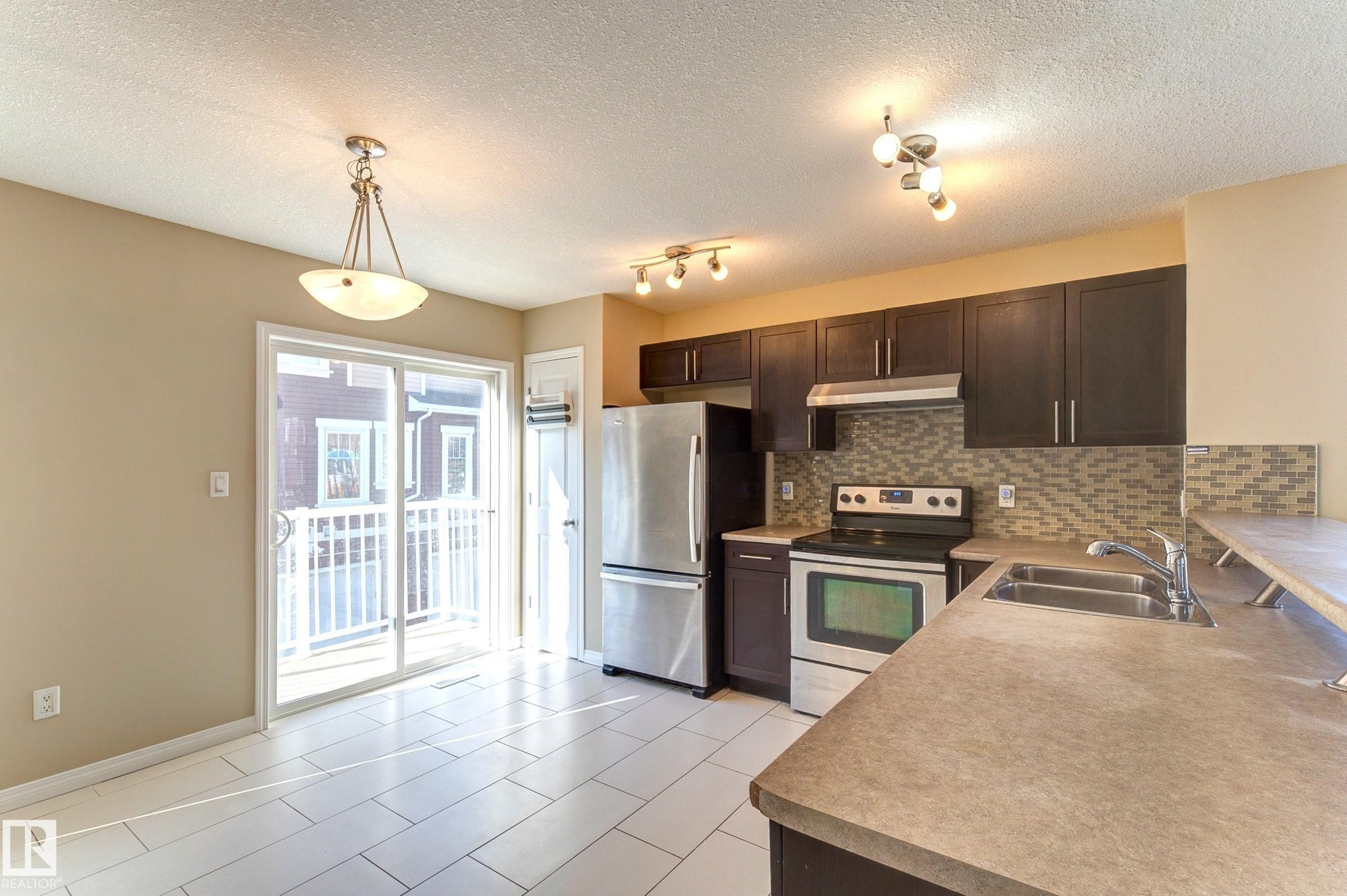 27 1623 Towne Centre Boulevard, Edmonton, AB - Indoor Photo Showing Kitchen With Stainless Steel Kitchen With Double Sink