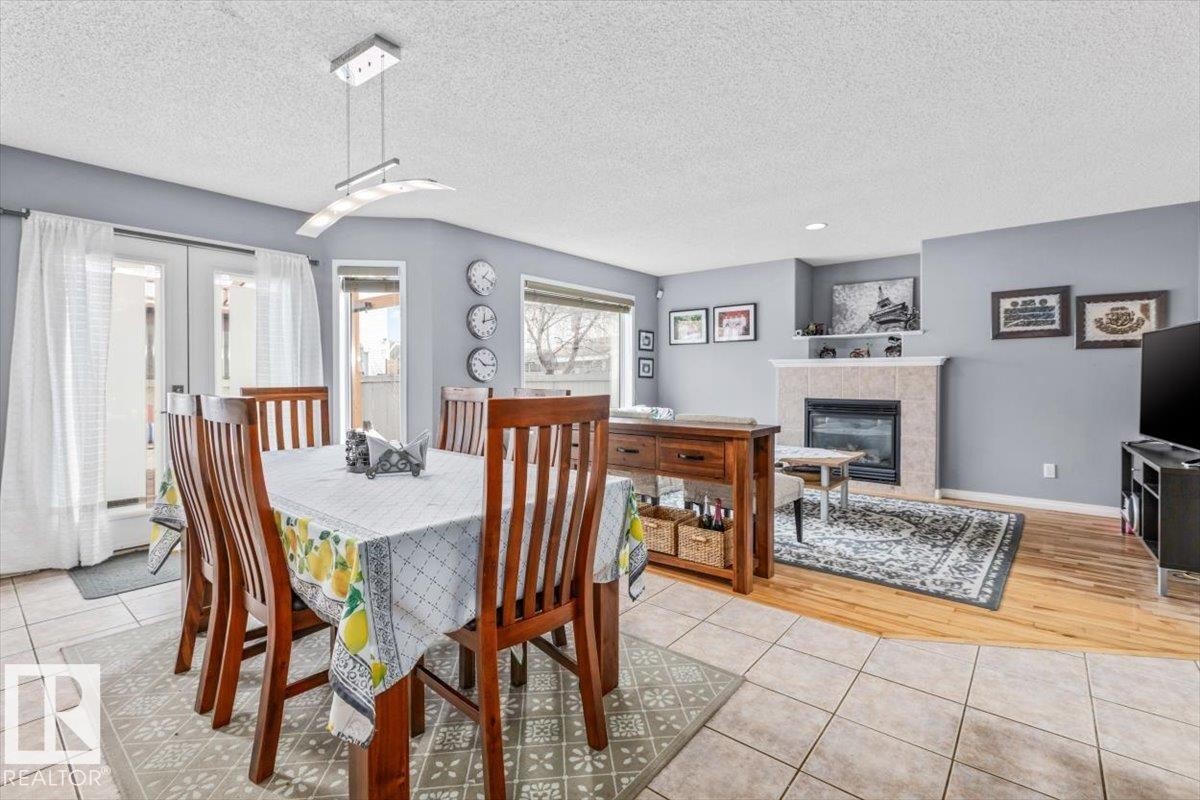 171 Cote Crescent, Edmonton, AB - Indoor Photo Showing Dining Room With Fireplace