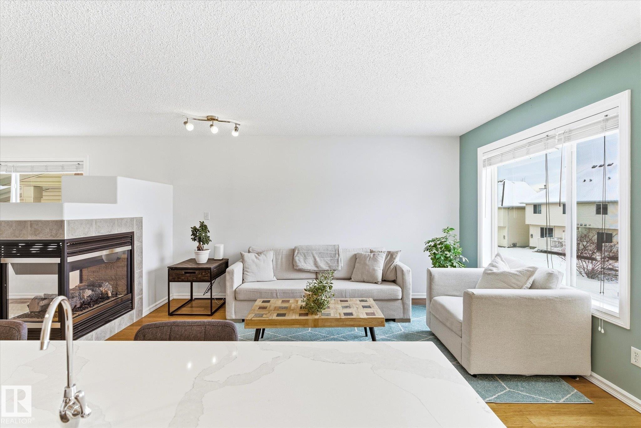 2550 Rabbit Hill Road, Edmonton, AB - Indoor Photo Showing Living Room With Fireplace