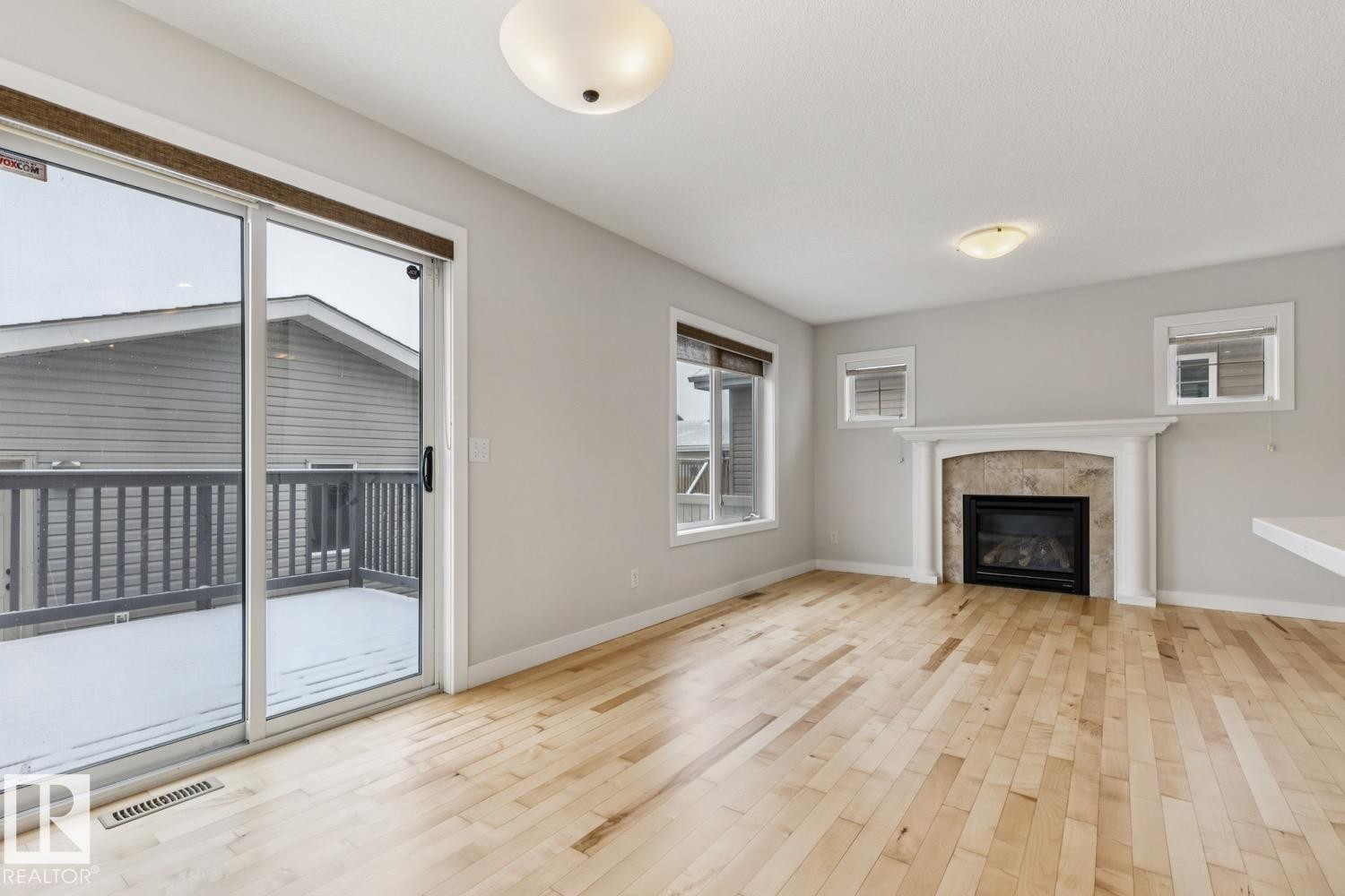 323 Avena Link, Leduc, AB - Indoor Photo Showing Living Room With Fireplace